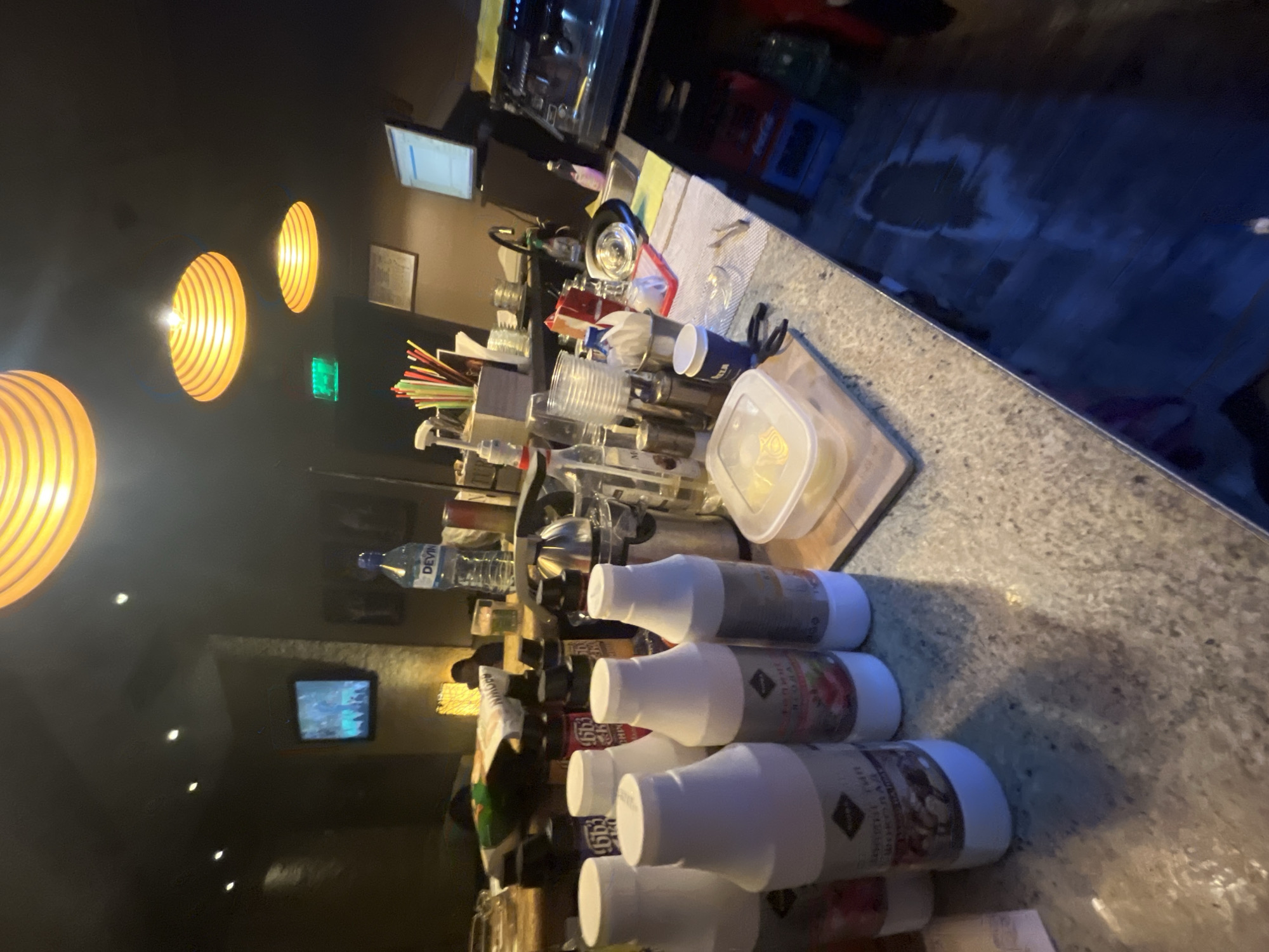 Cluttered bar counter observed in Svishtov, Bulgaria
