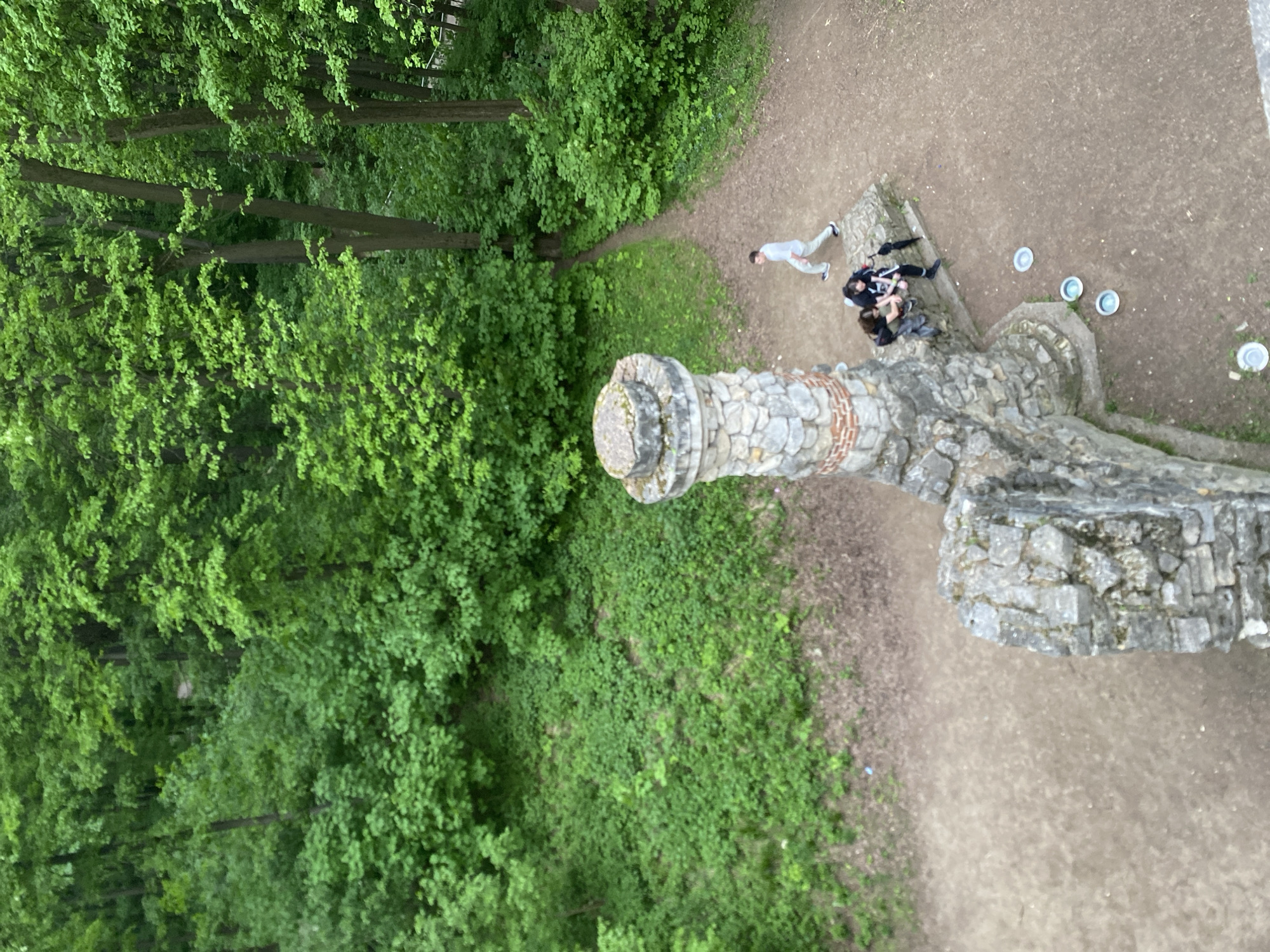 Afternoon visitors explore Moscow's Tsaritsyno Park, swans, castle ruins