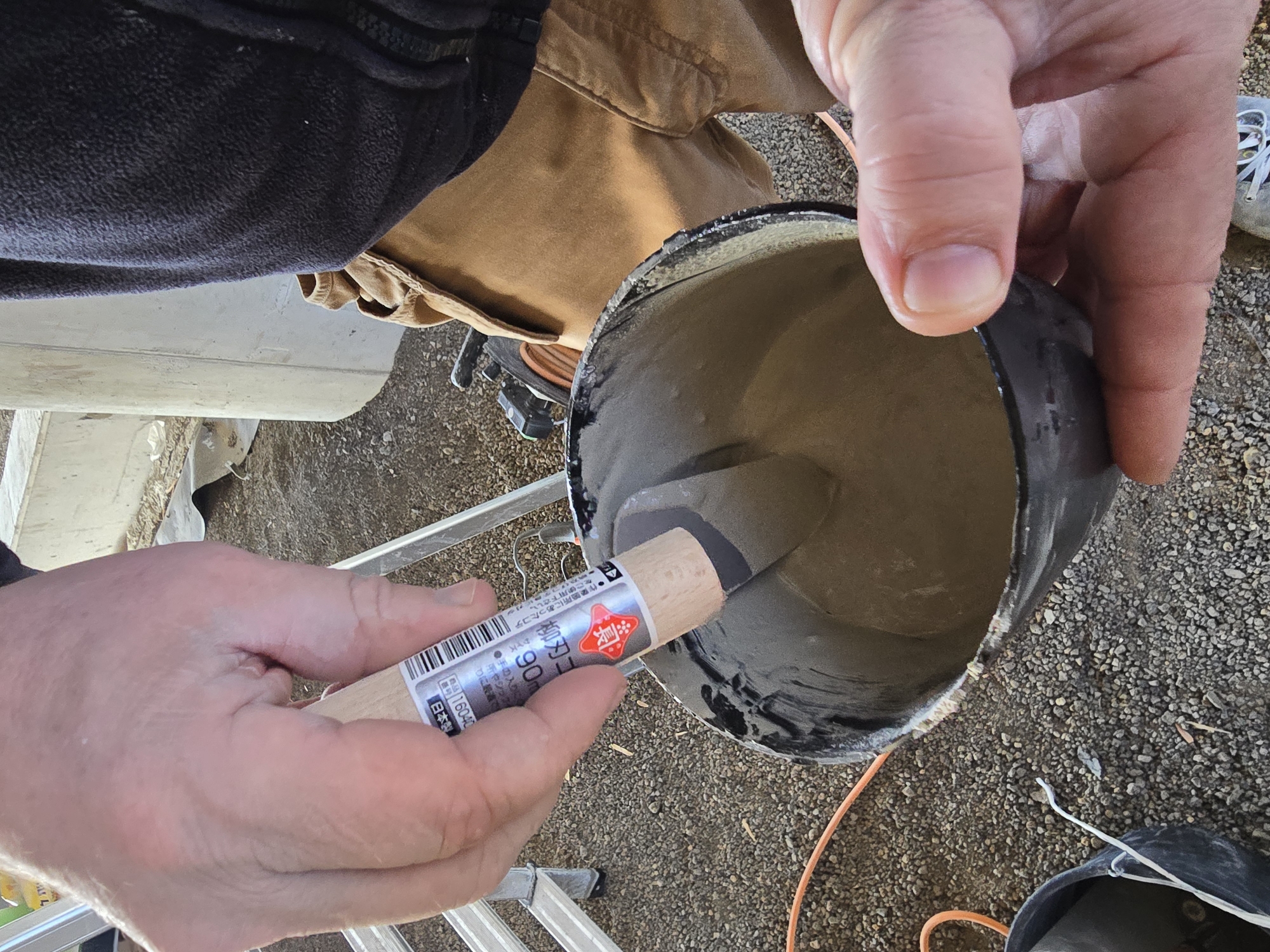 Construction workers repair concrete pillars in Ramat HaSharon