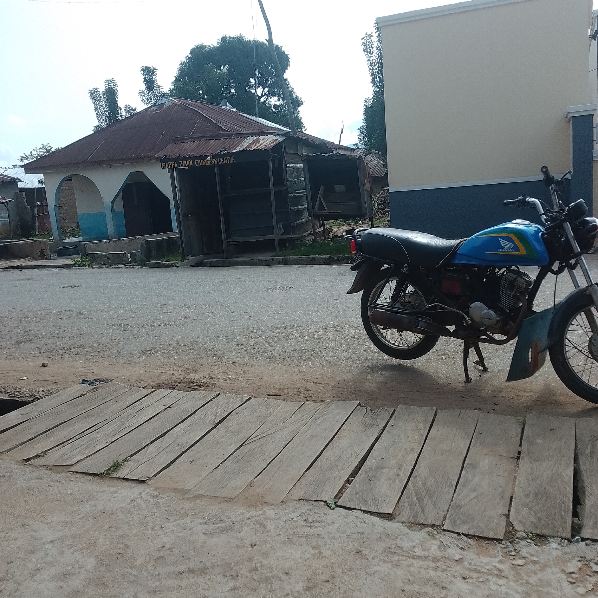 Tropical semi-rural streets, construction sites, and palm-lined paths
