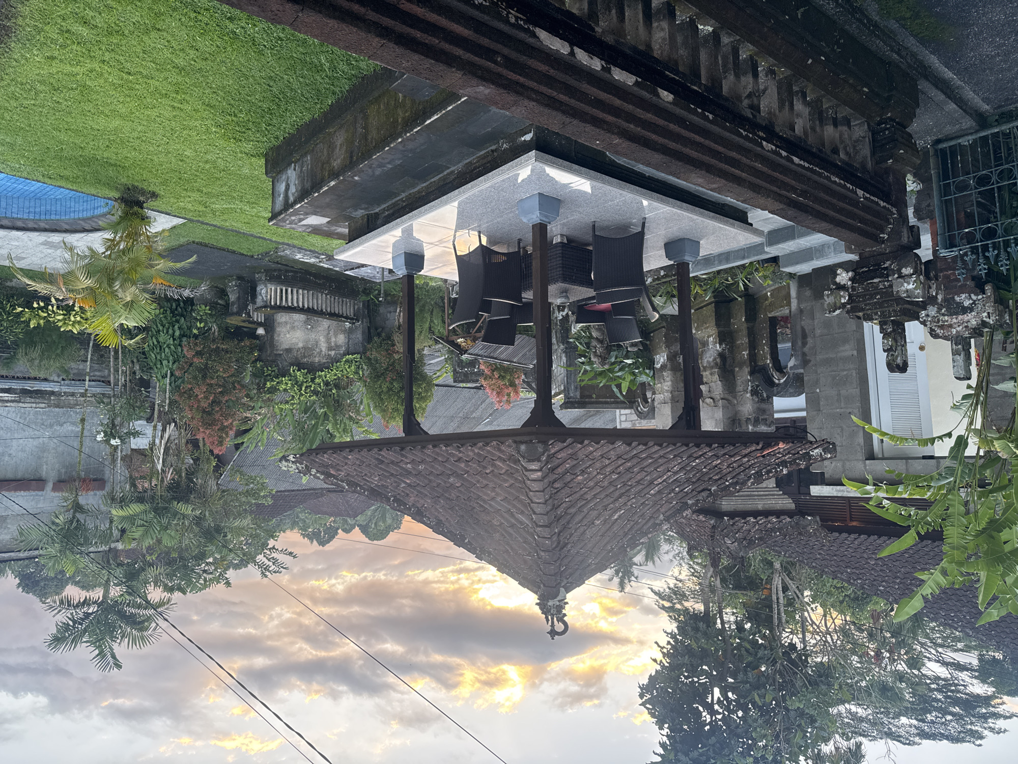 Traditional Balinese residence observed at dusk in Ubud District