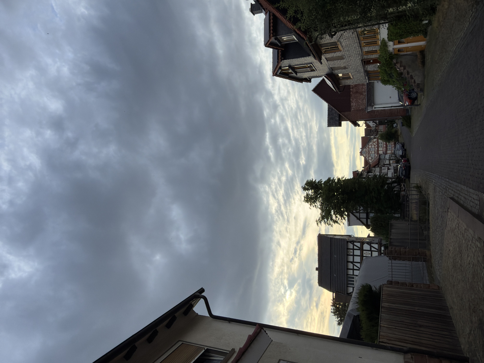 Street-level and sky views in a cloudy European town