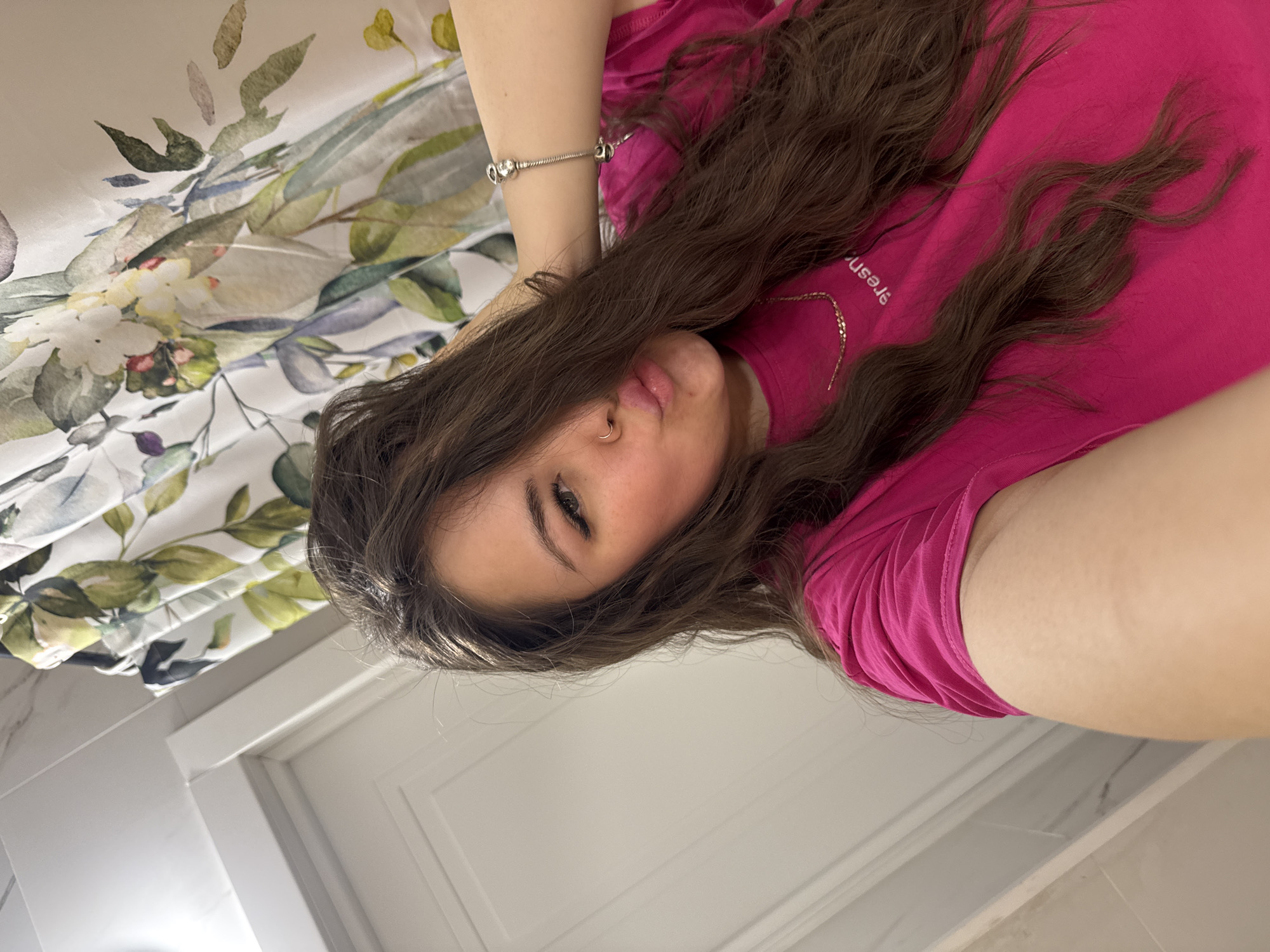 Woman takes selfies with pink iPhone in Russia