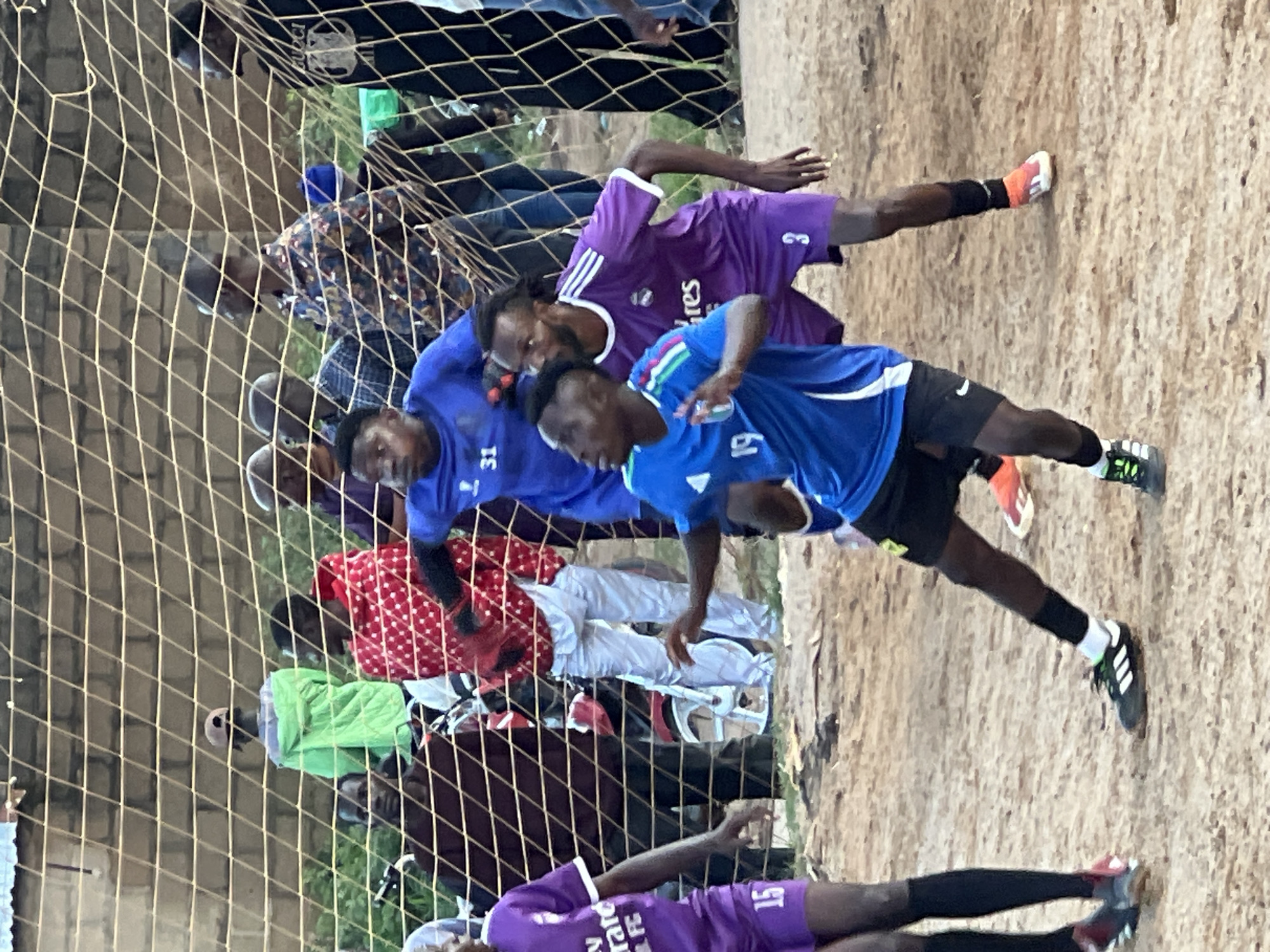 Pickup soccer match draws a crowd in Jos, Nigeria