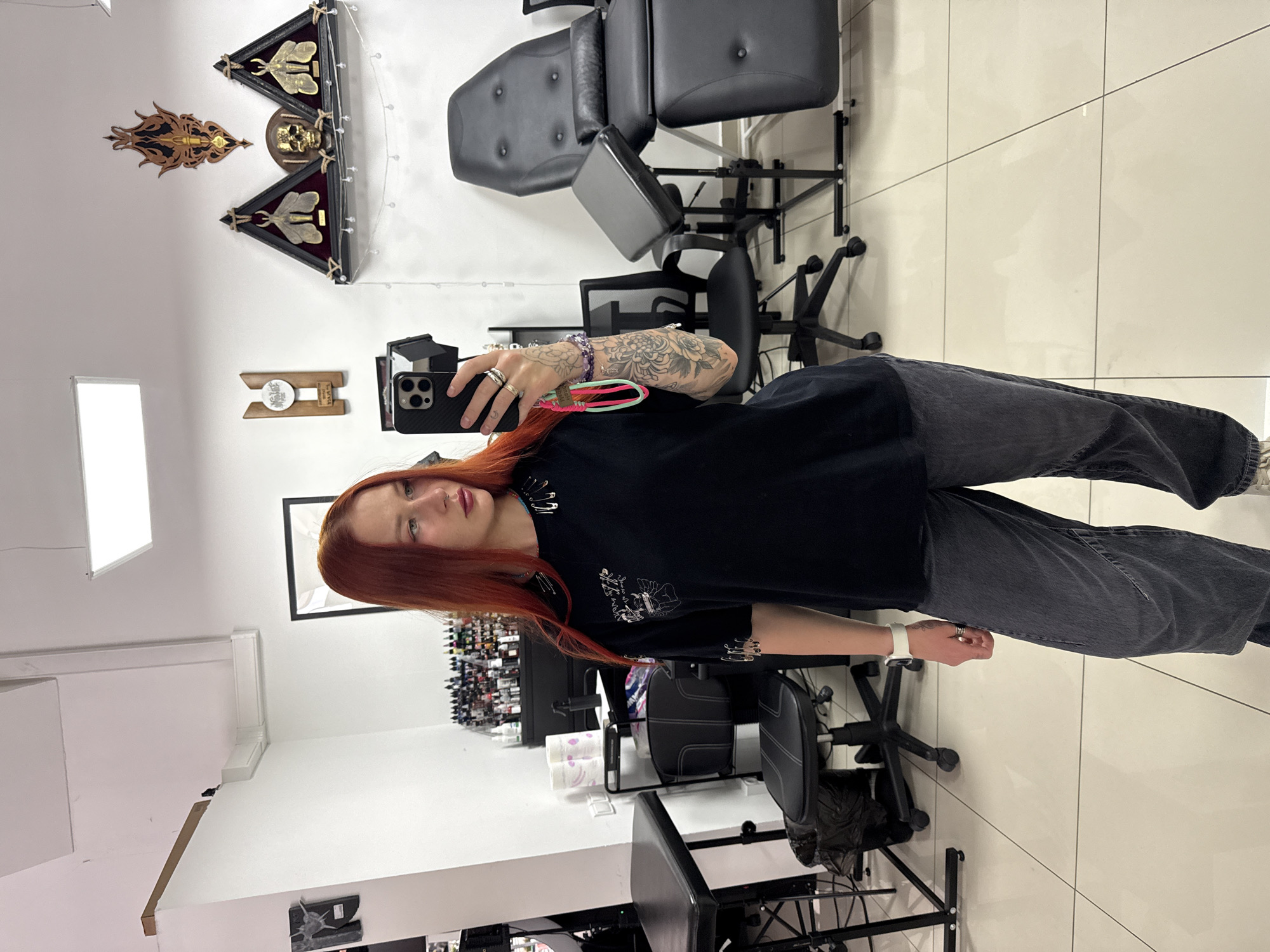 Woman takes selfies in Rostov-on-Don tattoo studio