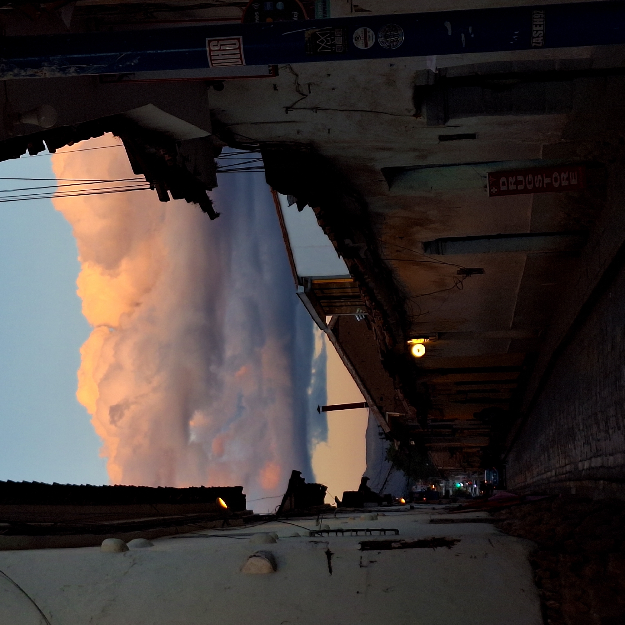 Dusk clouds photographed over historic Cusco streets