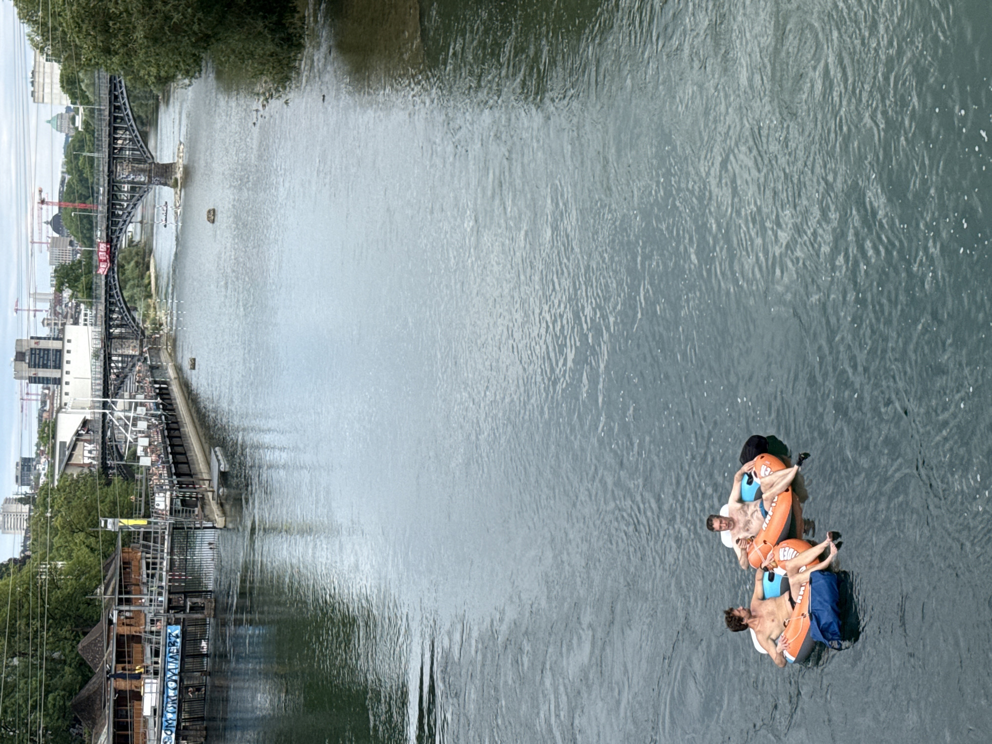 Tubing down the Limmat on a summer afternoon in Zurich