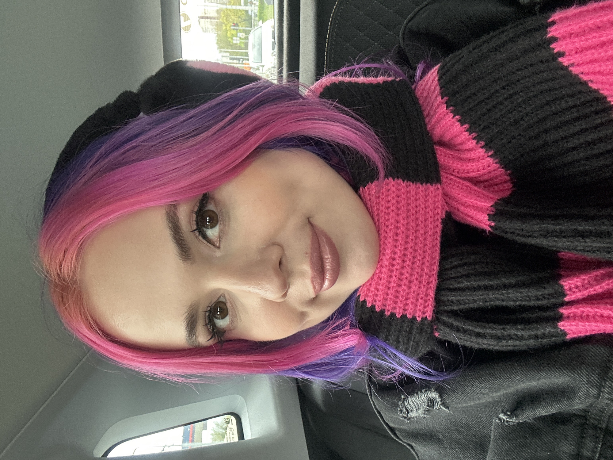 Woman with colorful hair photographed in car in Zagreb