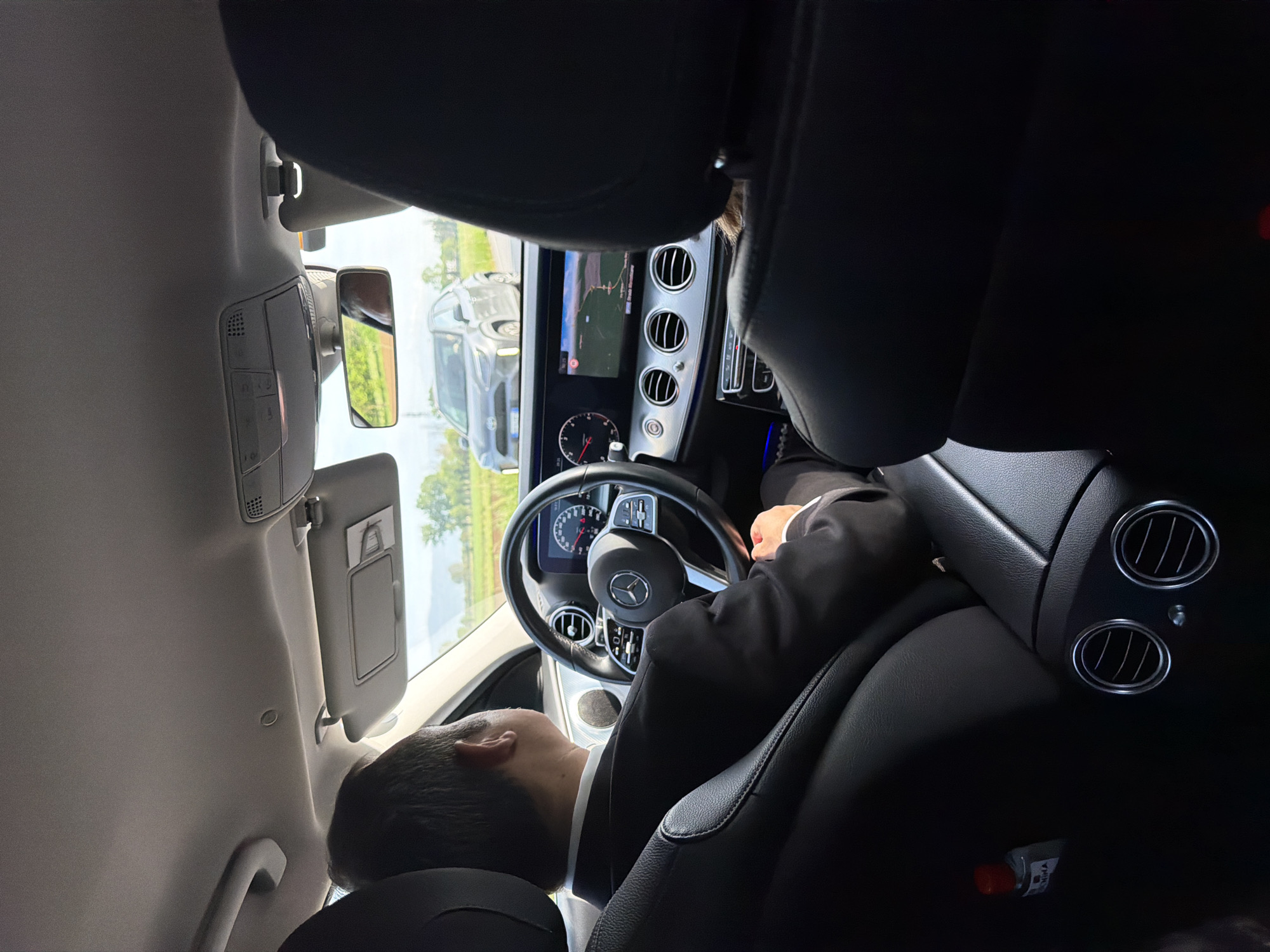 Man in suit photographed sleeping in car in Vicenza