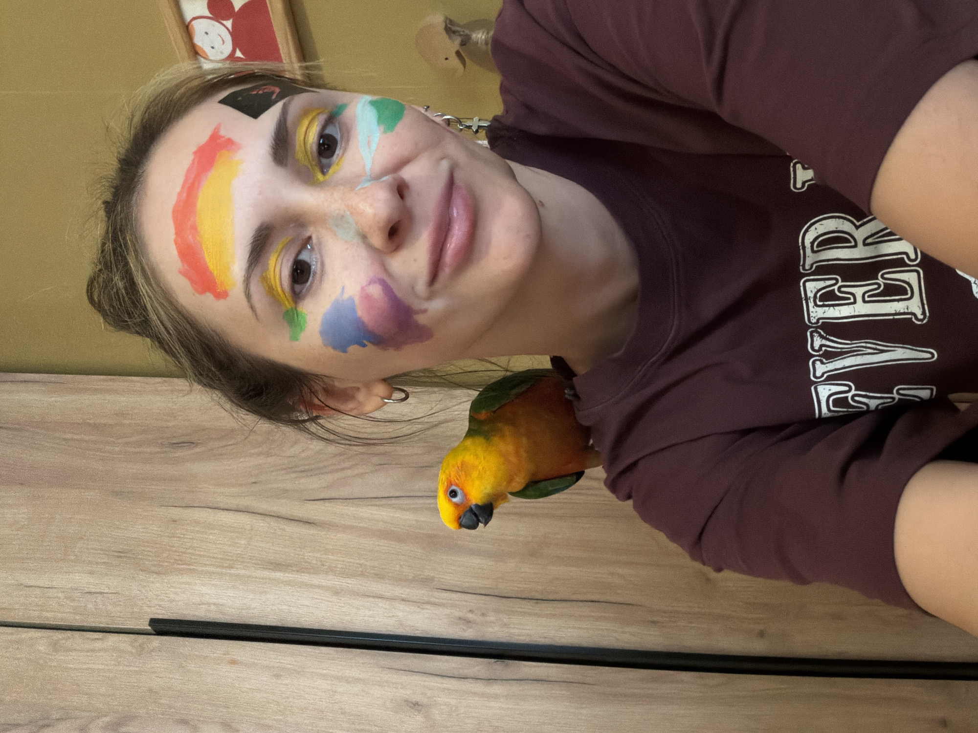 Mother, daughter face painting session with pet parrot in Khimki
