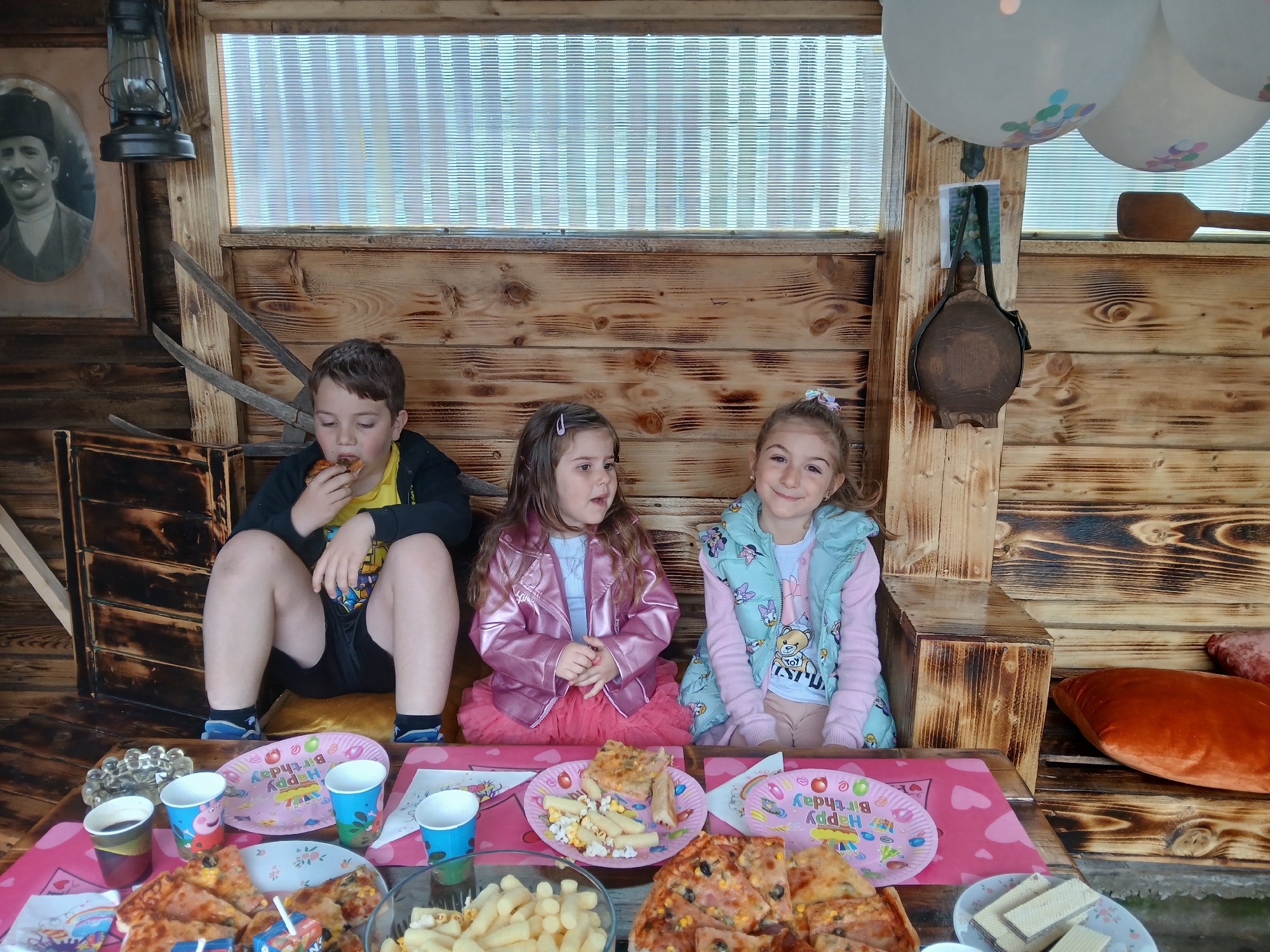 Children play and eat during casual gathering in Bulgarian village