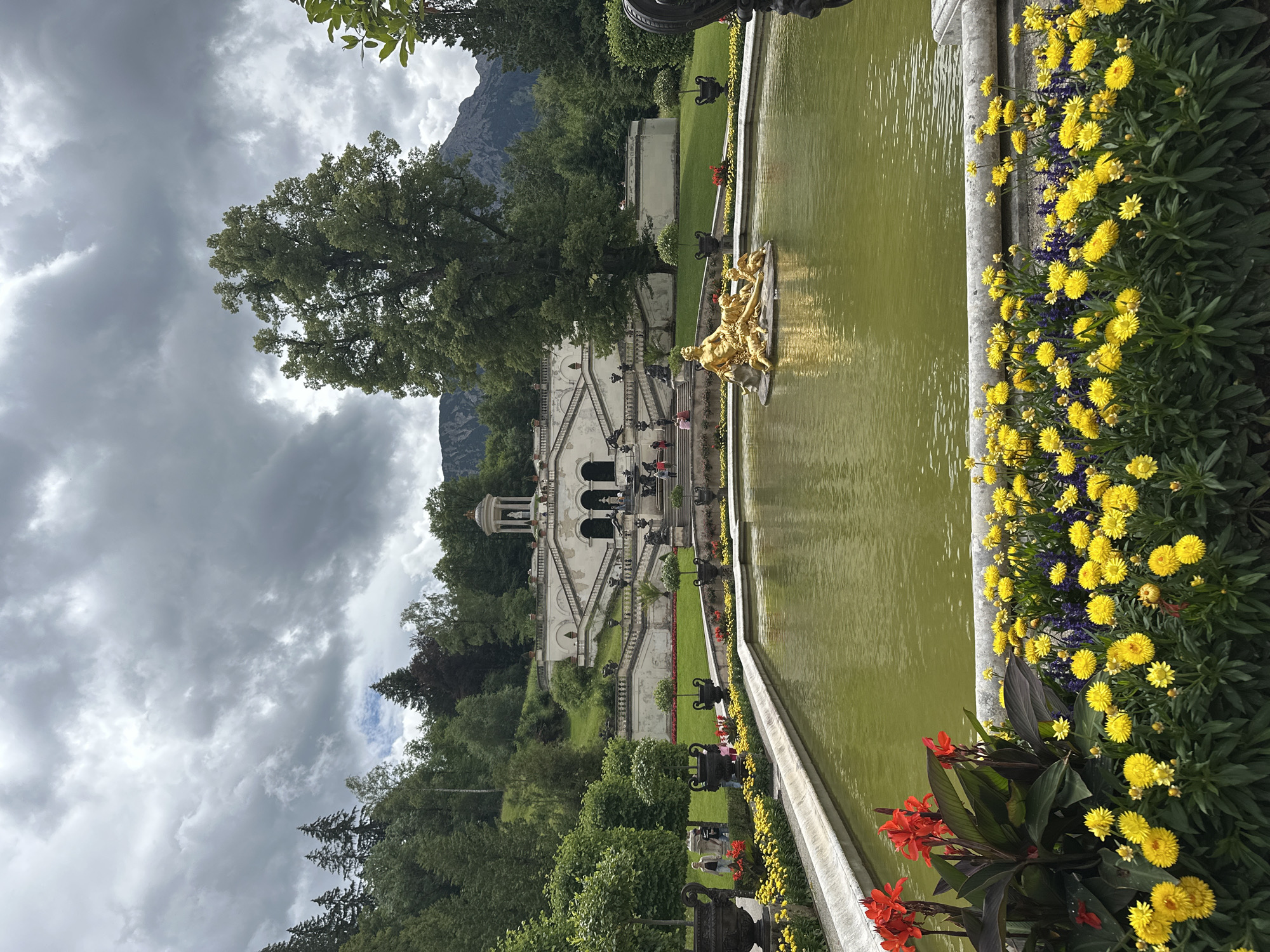 Linderhof Palace gardens and Ettal village on a cloudy morning