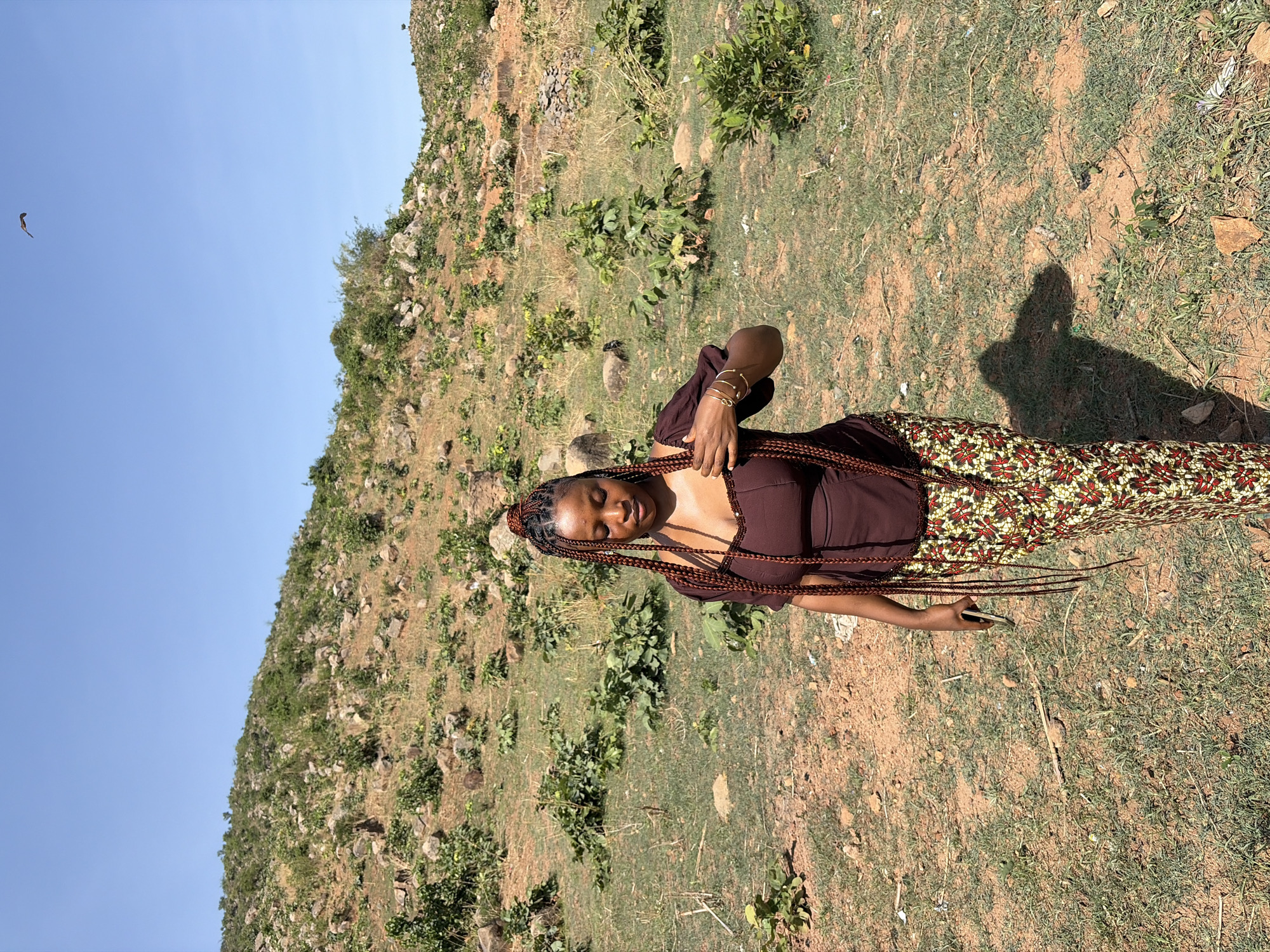 Woman photographed on hillside in Jos, Nigeria