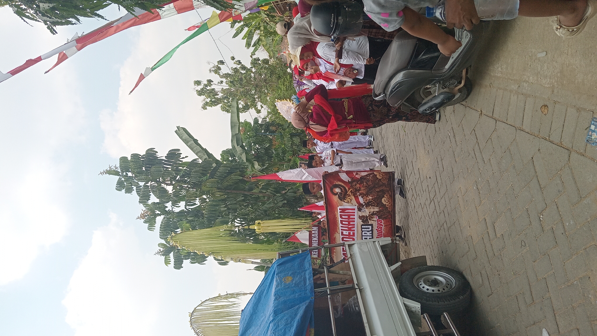 Street parade with costumed performers in Kedungwaru, Indonesia