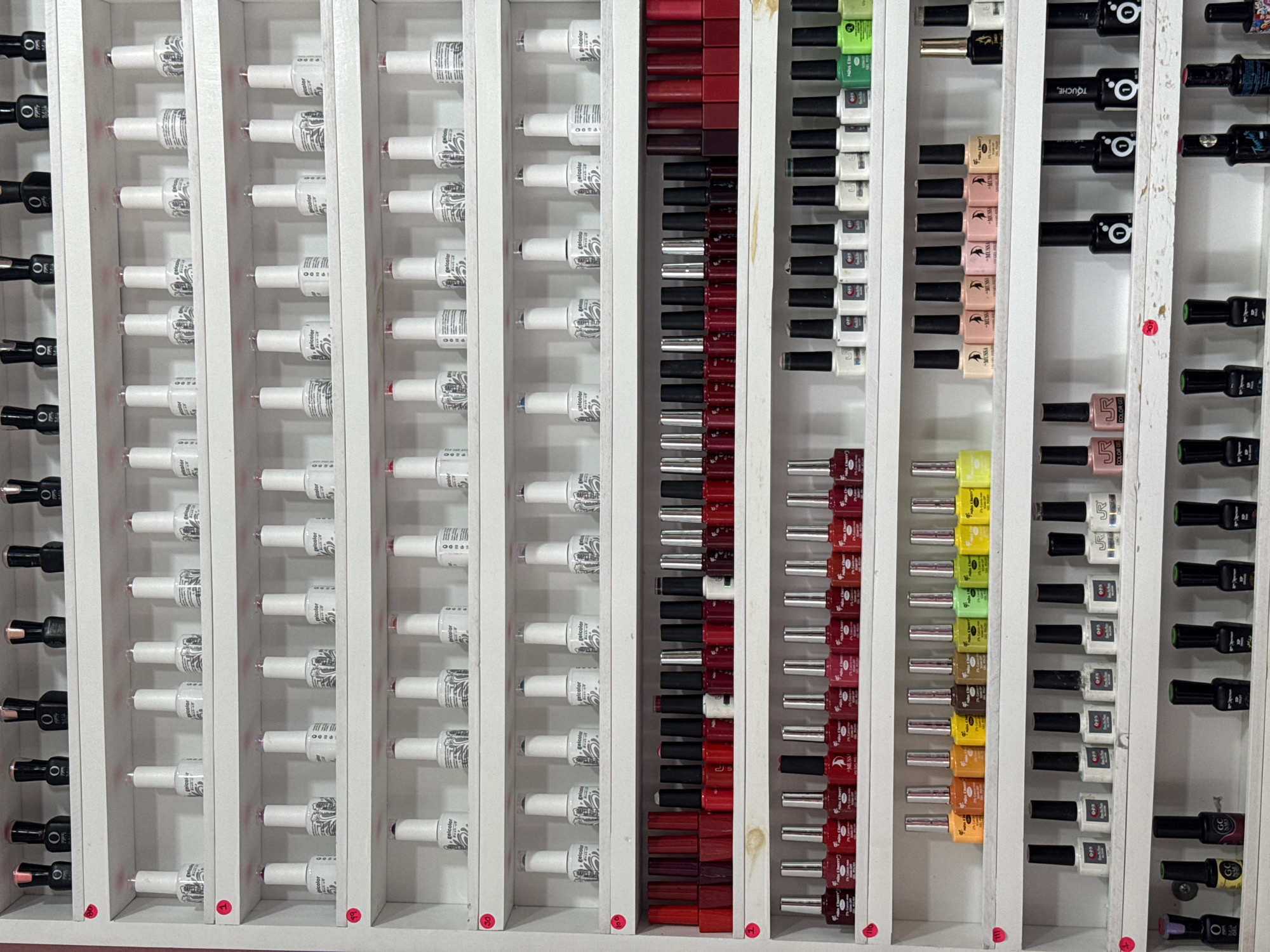 Nail polish display documented at Cholula beauty establishment