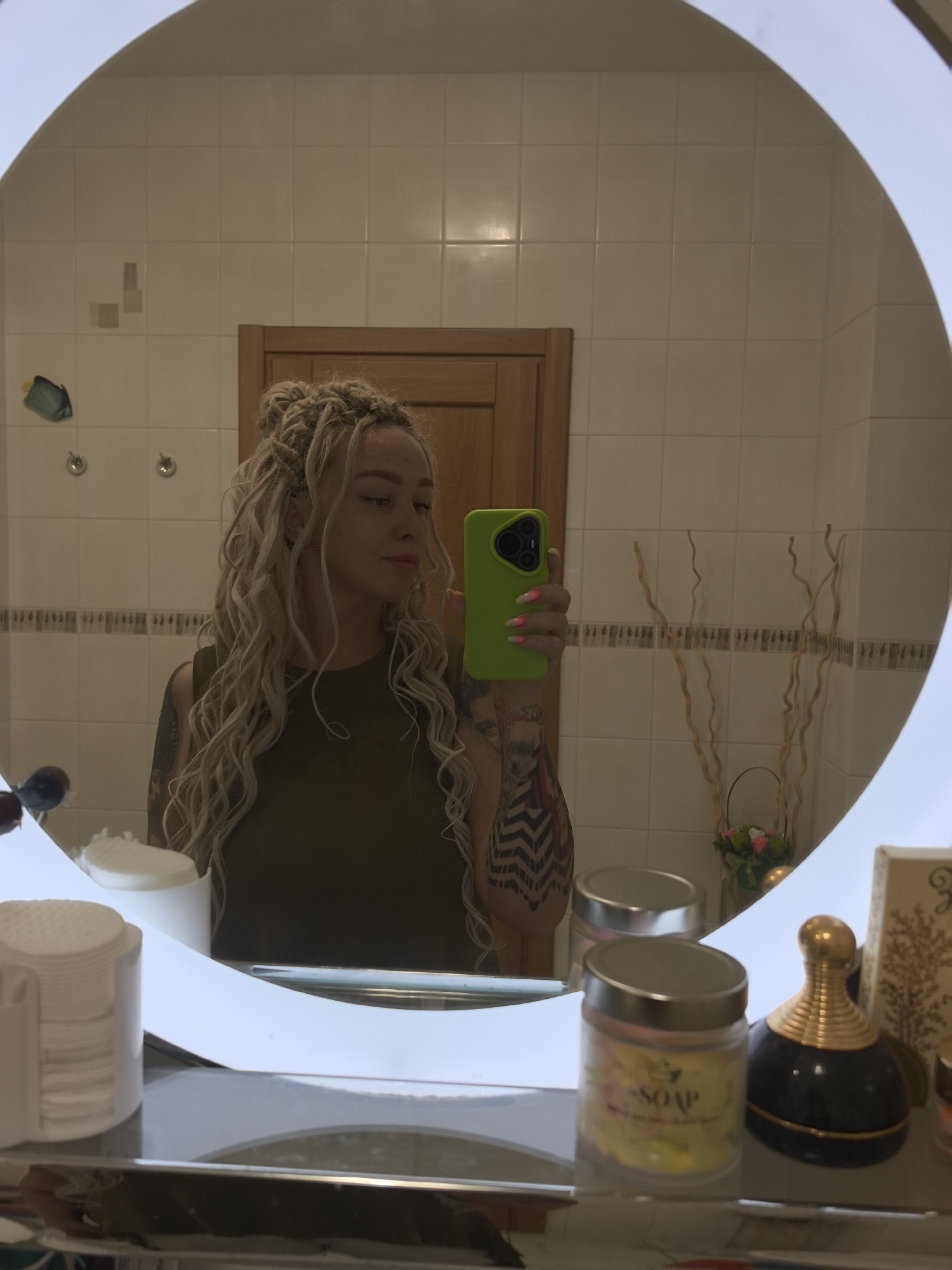 Bathroom mirror selfie with a green phone, Nizhny Novgorod