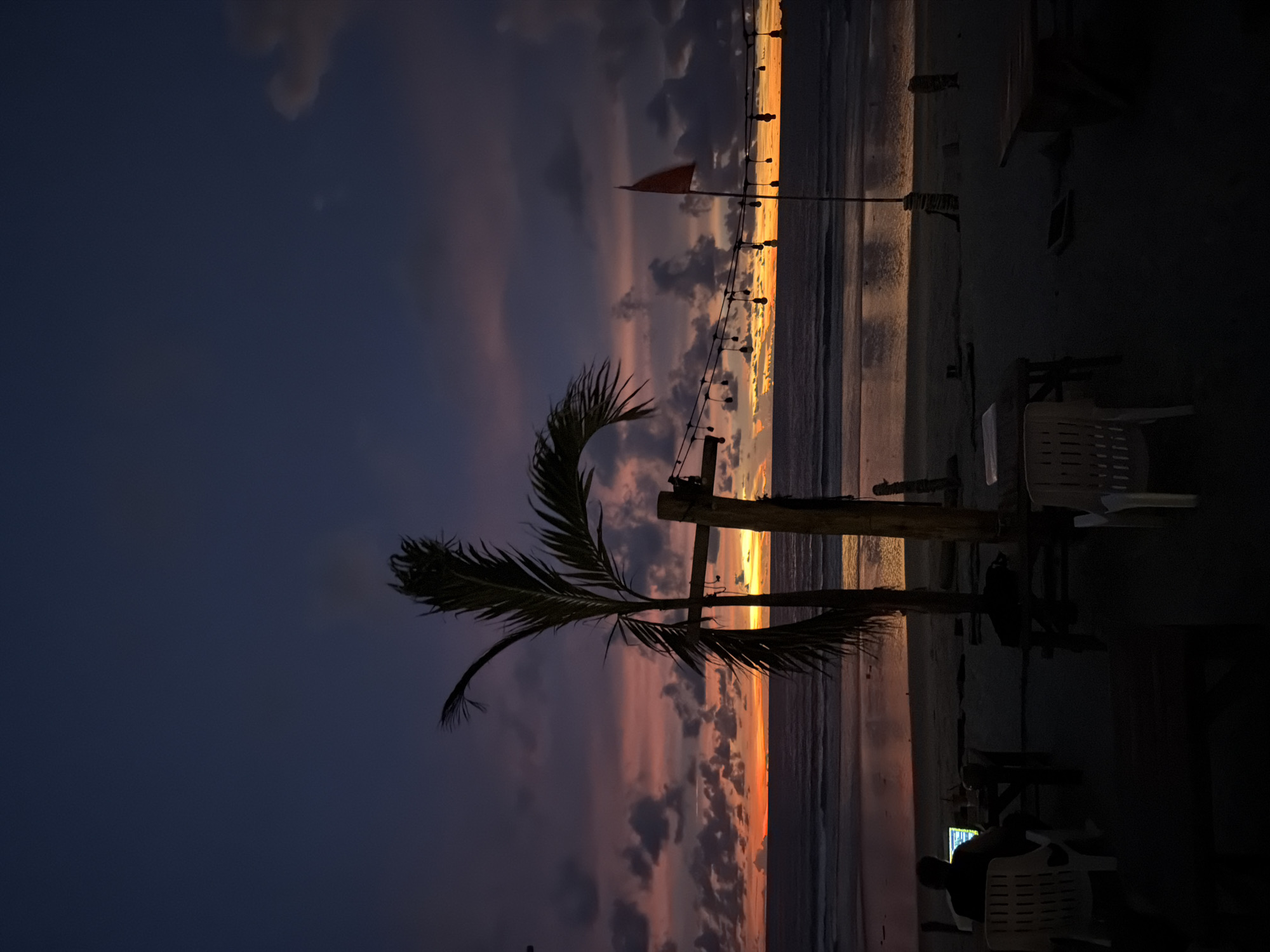 Sunset hour on a Choeng Thale beach, silhouettes and fading light