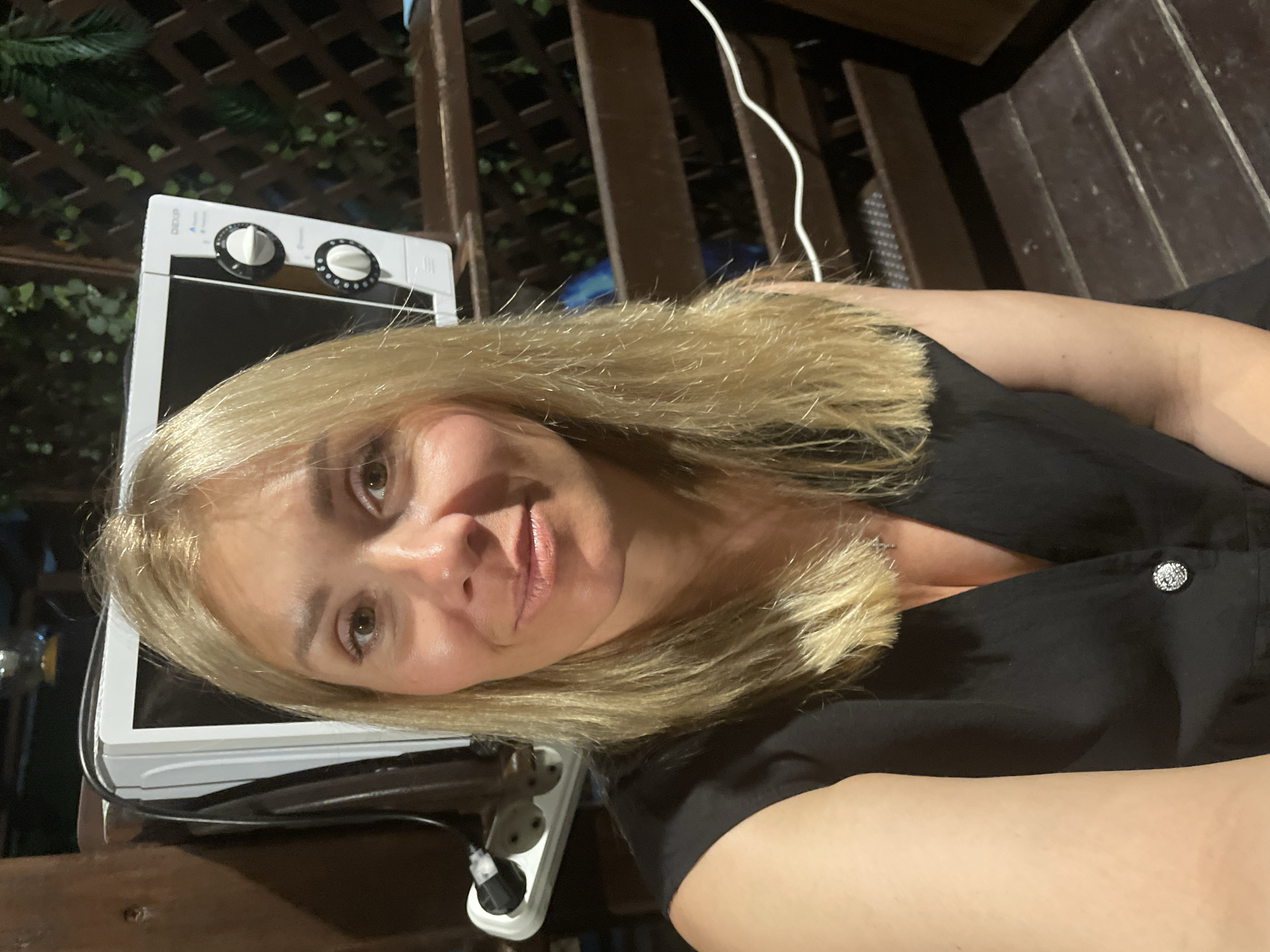 Evening outdoor kitchen selfie session with natural garden elements