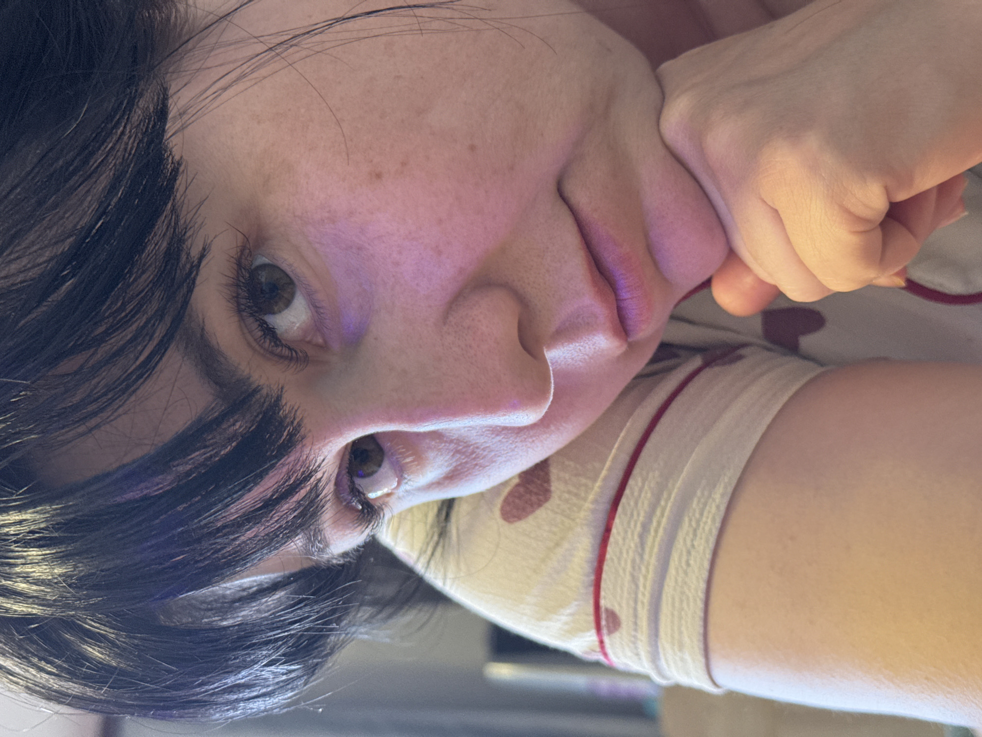 Woman in pajamas photographed with sleeping cat in Zav'yalovo