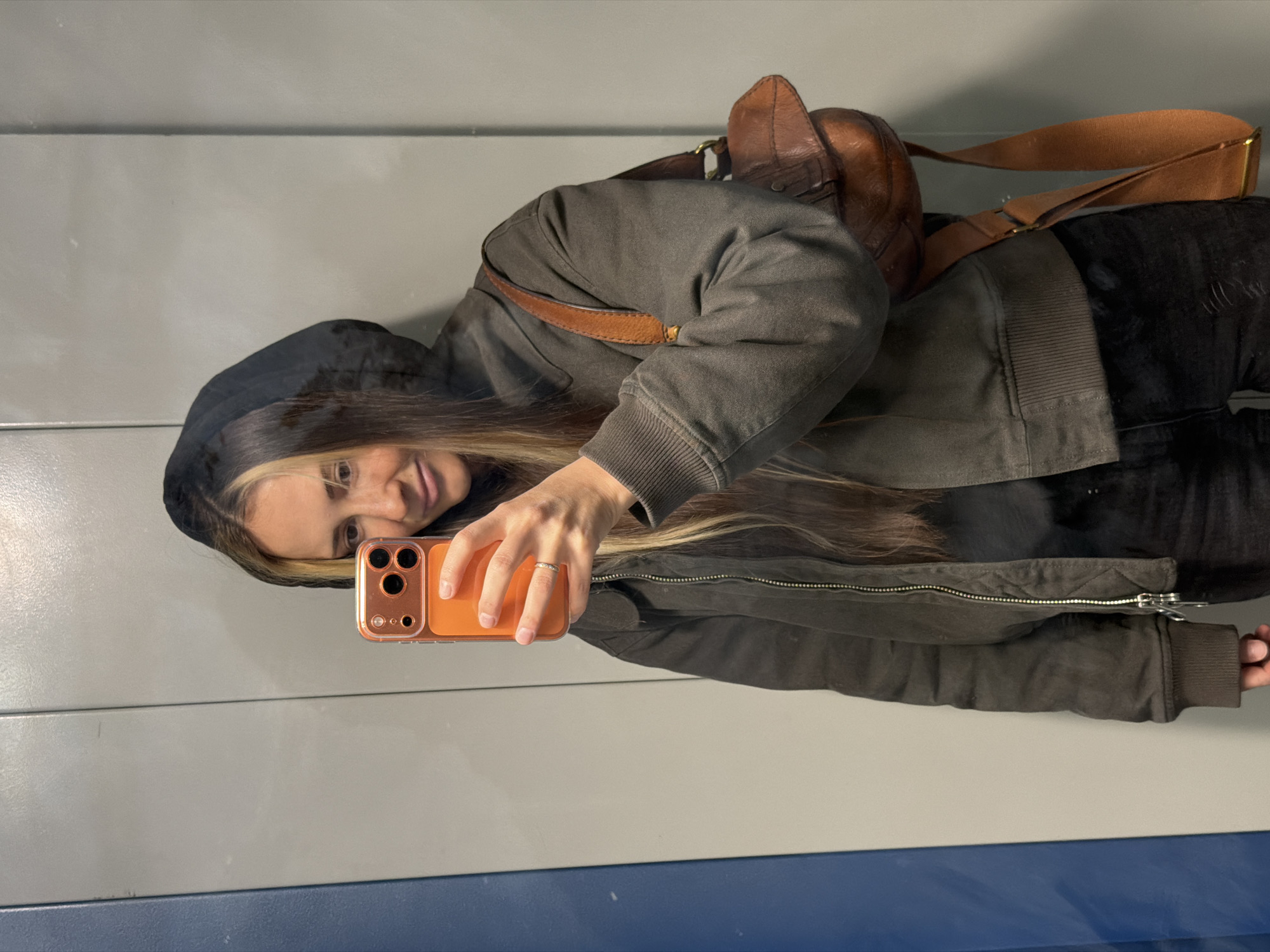 Woman takes mirror selfie in Khimki, Russia