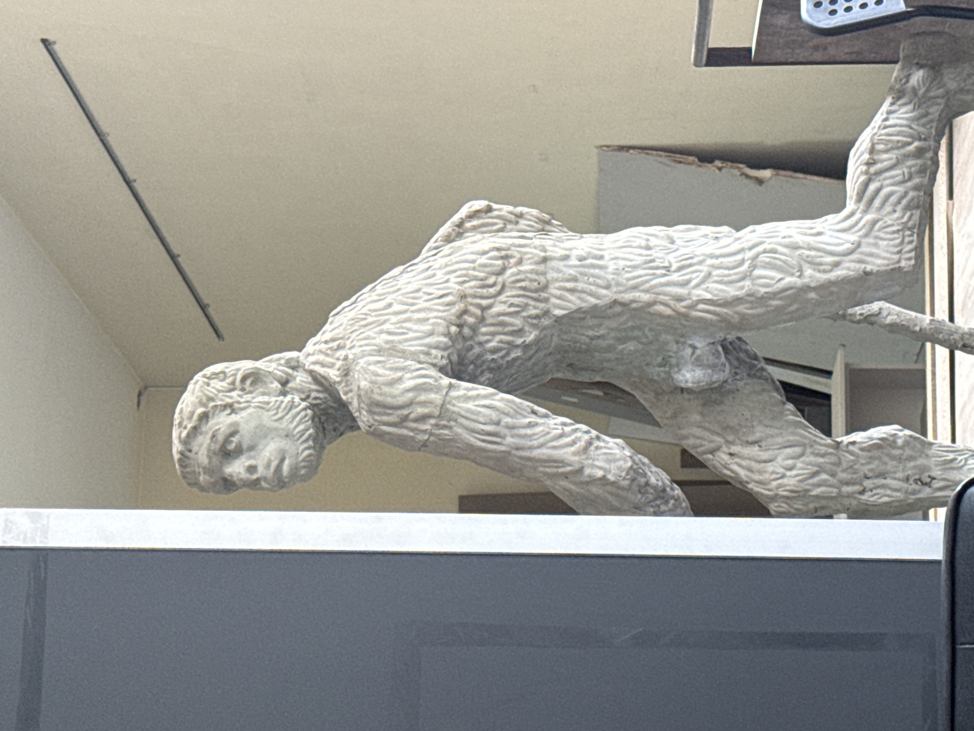 Stone male statue spotted on Plovdiv building facade