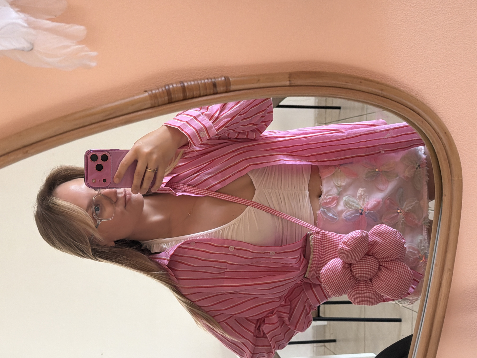 Mirror selfie featuring a layered floral outfit in Tel Aviv