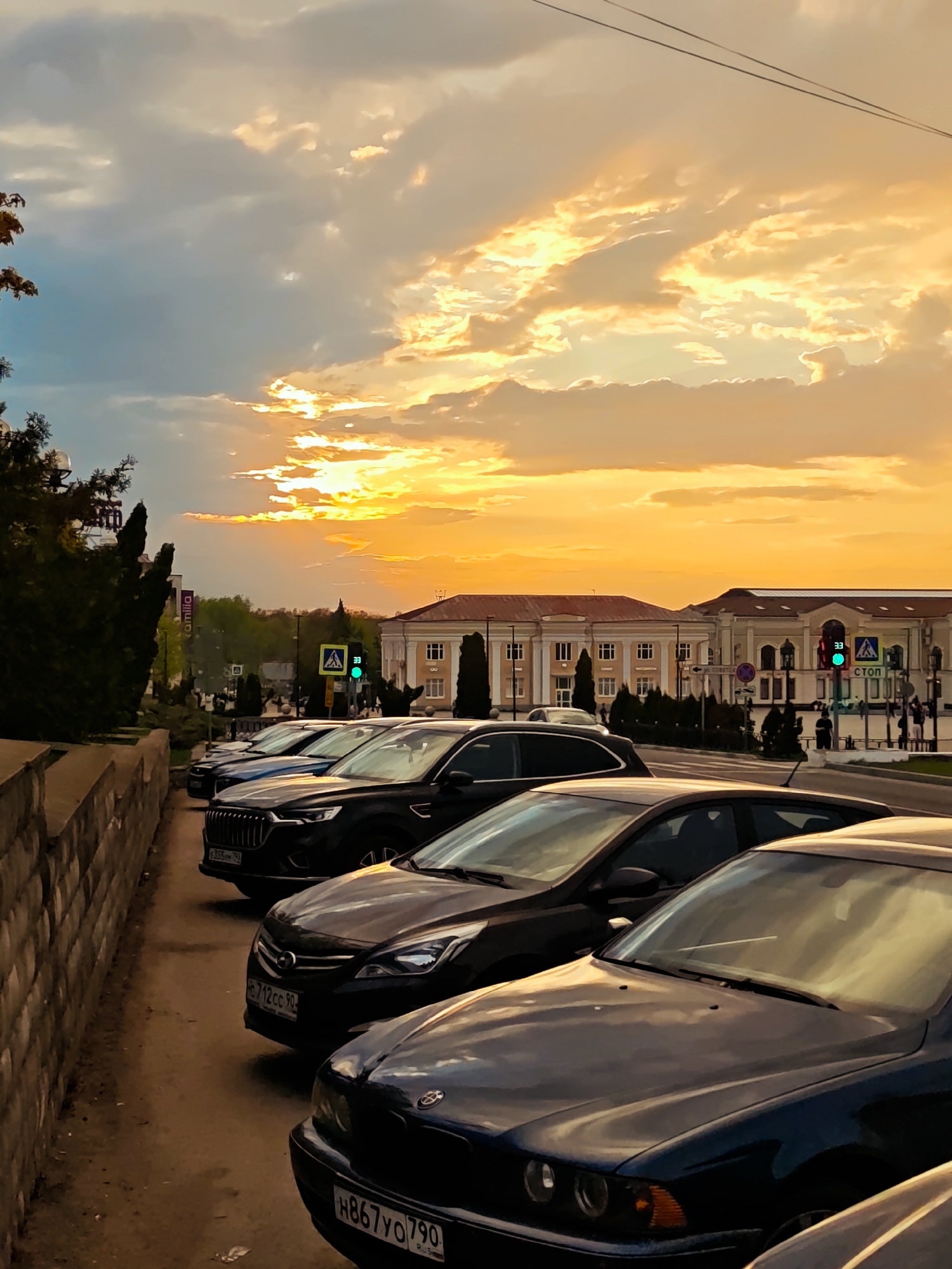 Evening scenes captured across Dmitrov, Russia show fountains, monuments