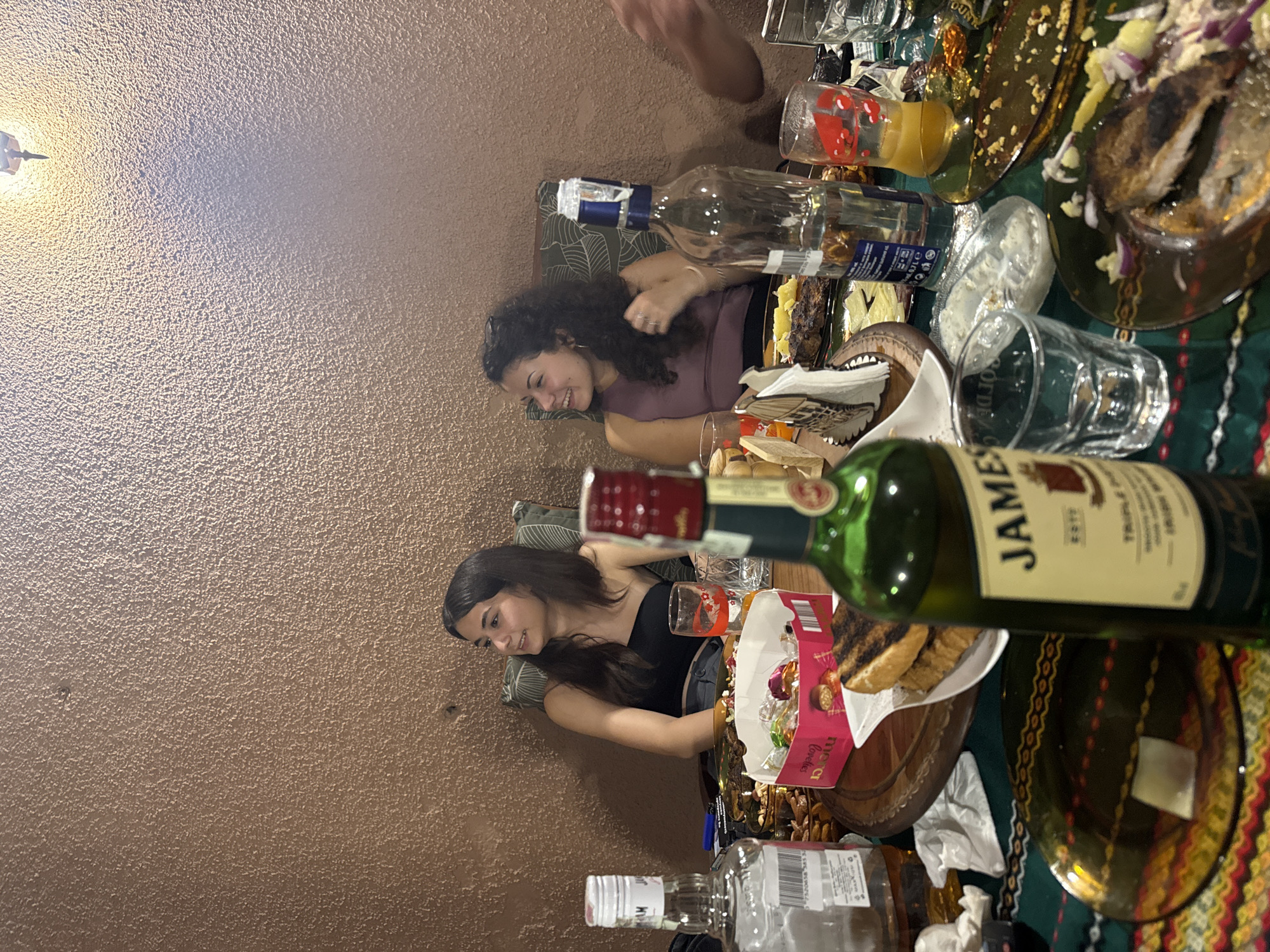 Casual evening gathering around food and drinks in Yambol