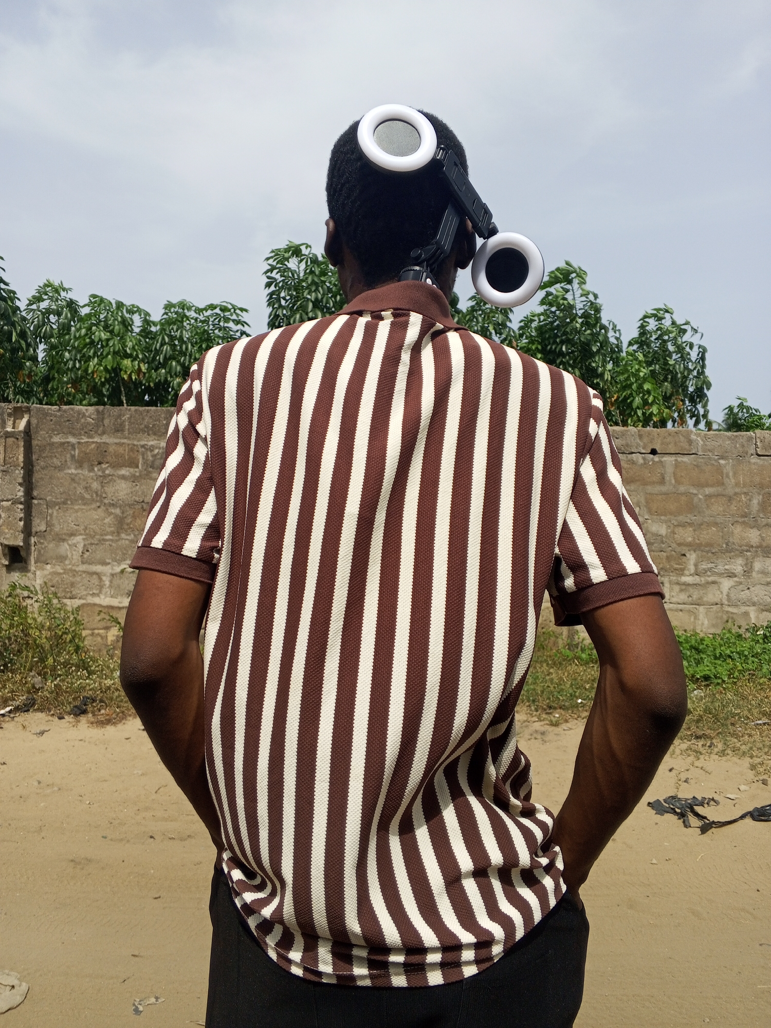 Content creator films with equipment in Badagry, Nigeria