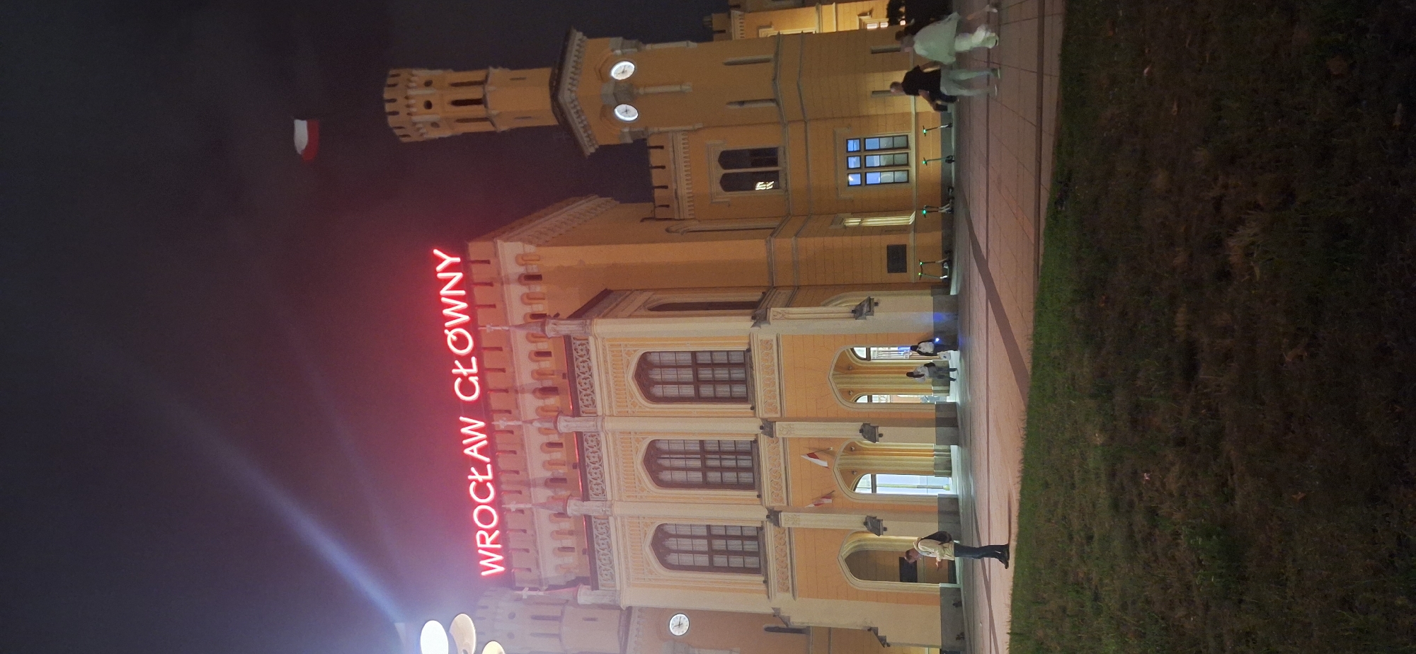 Nighttime at Wrocław Główny station, coffee and luggage in tow