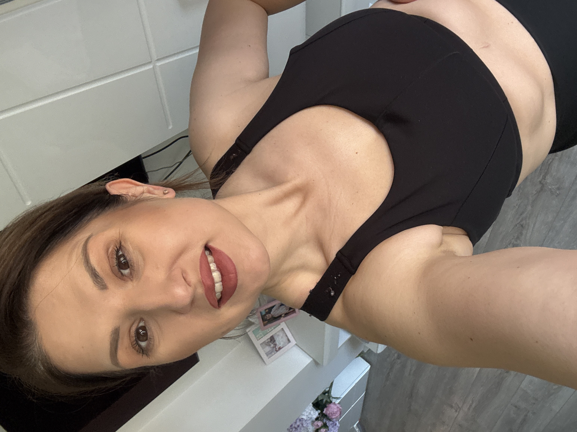Woman takes multiple selfies indoors across Sofia morning