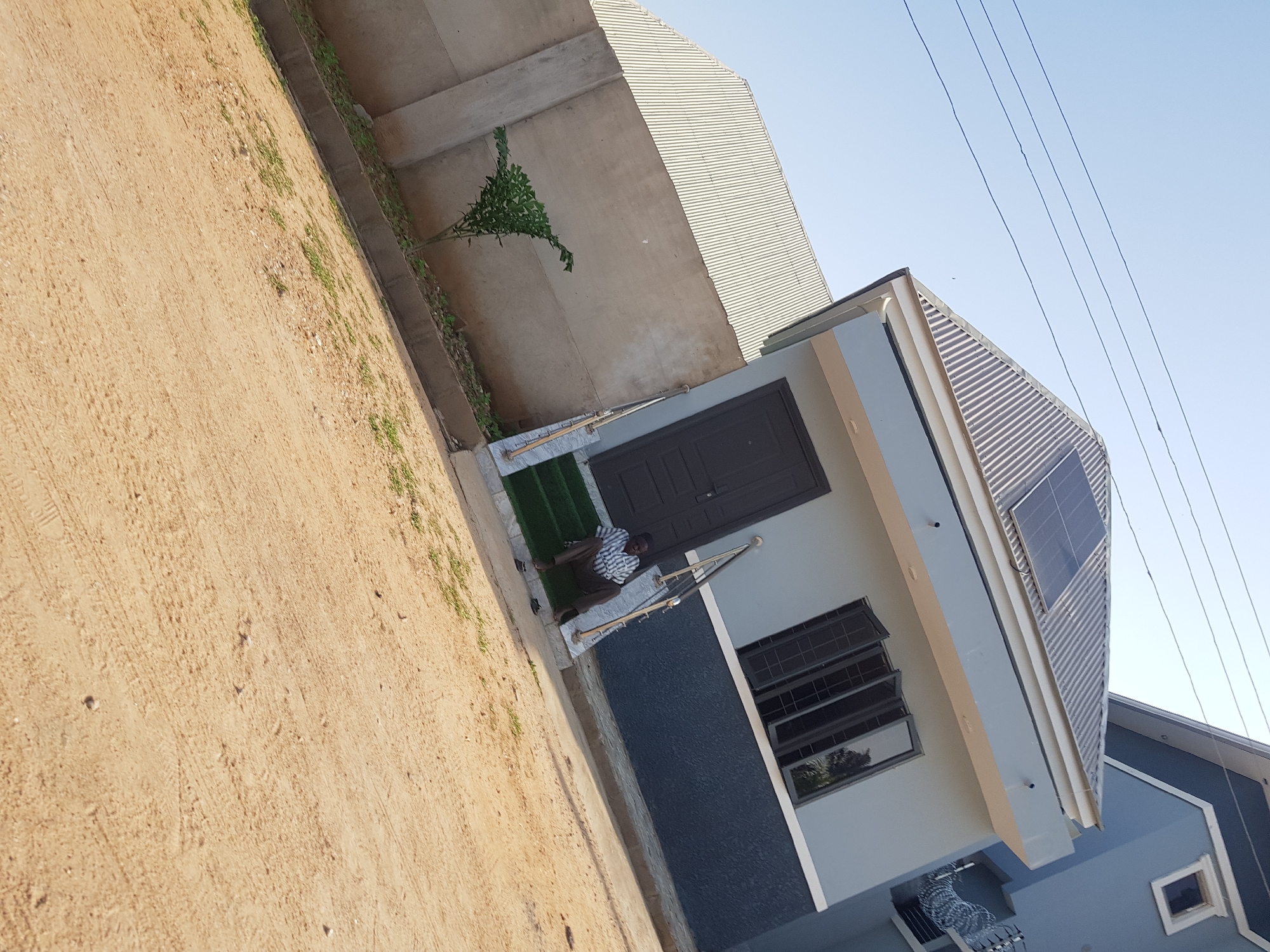 Morning street walk through a residential neighborhood in Palade, Nigeria