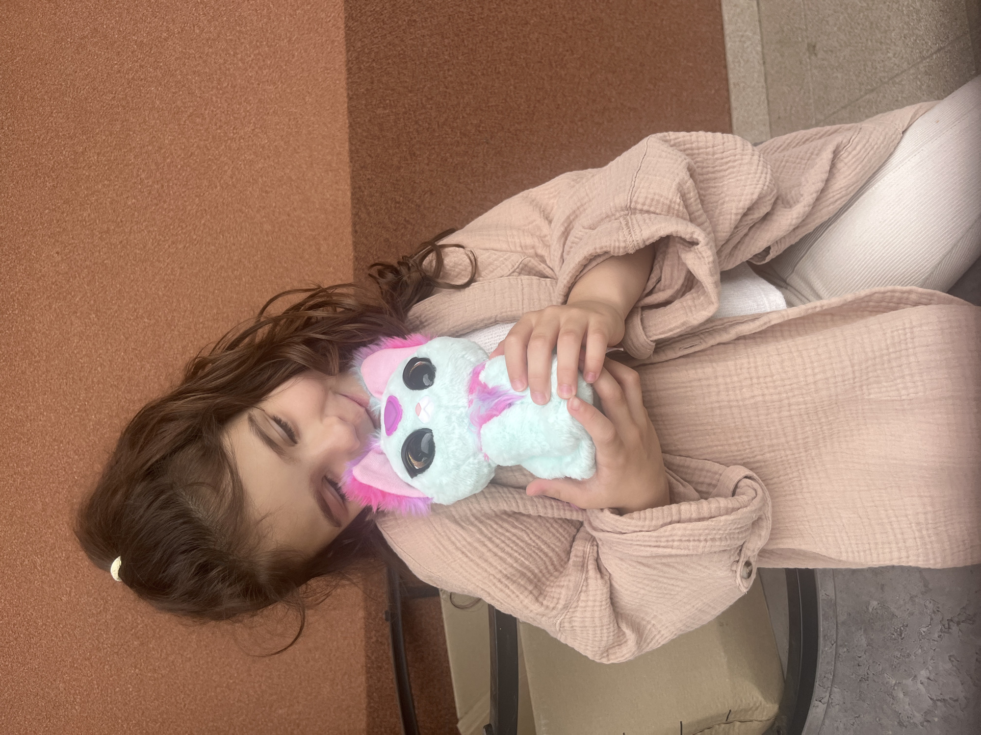 Young girl photographed with plush toy in Onokivtsi, Ukraine