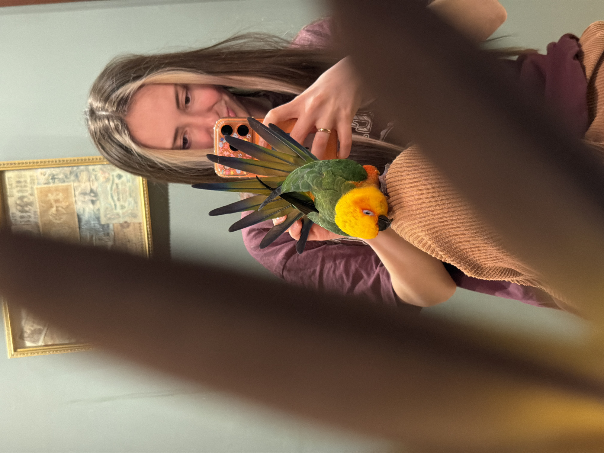 Woman poses with parrot perched on cup in Khimki