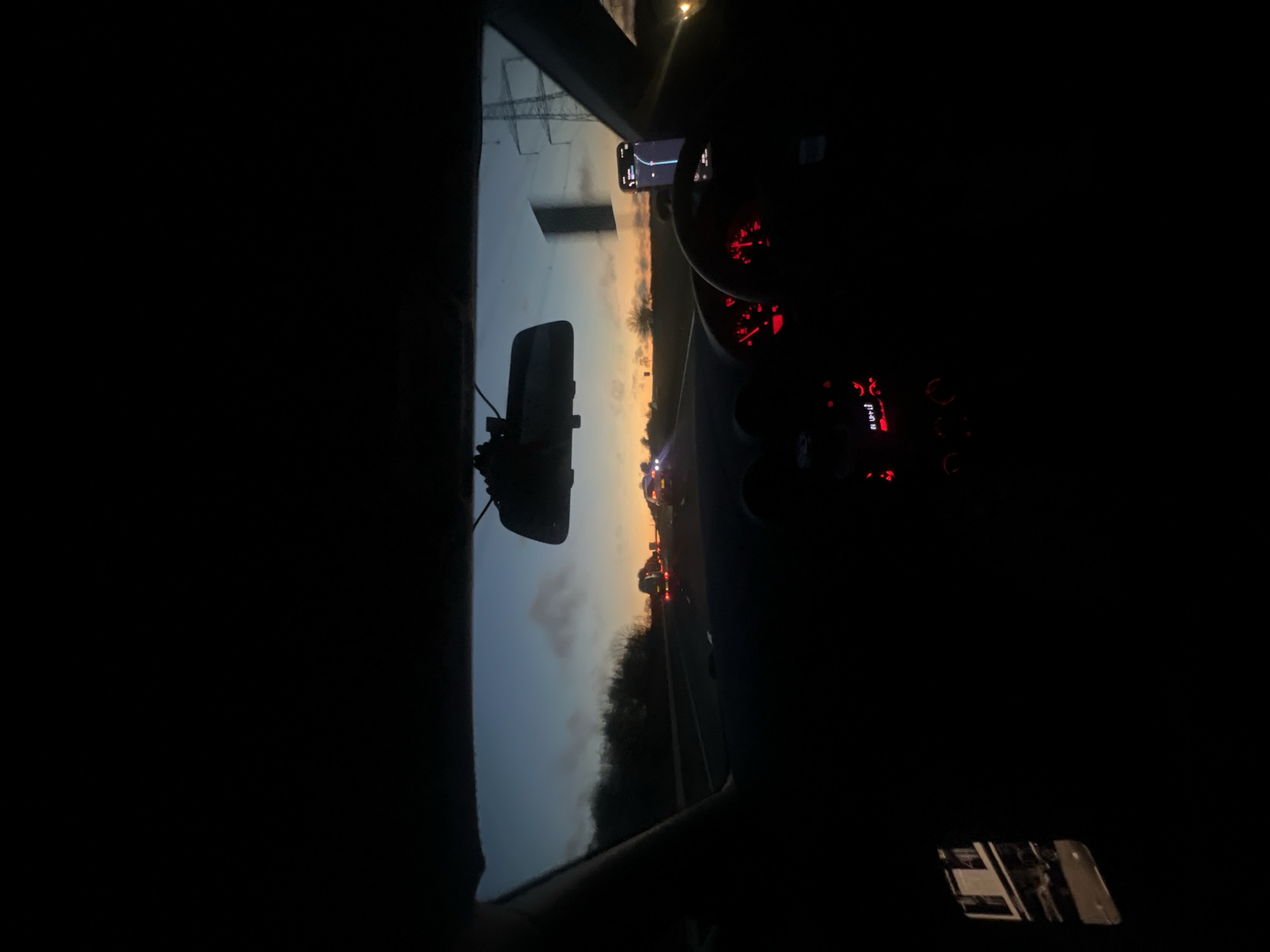 Evening drive captured through windshield in Dodington