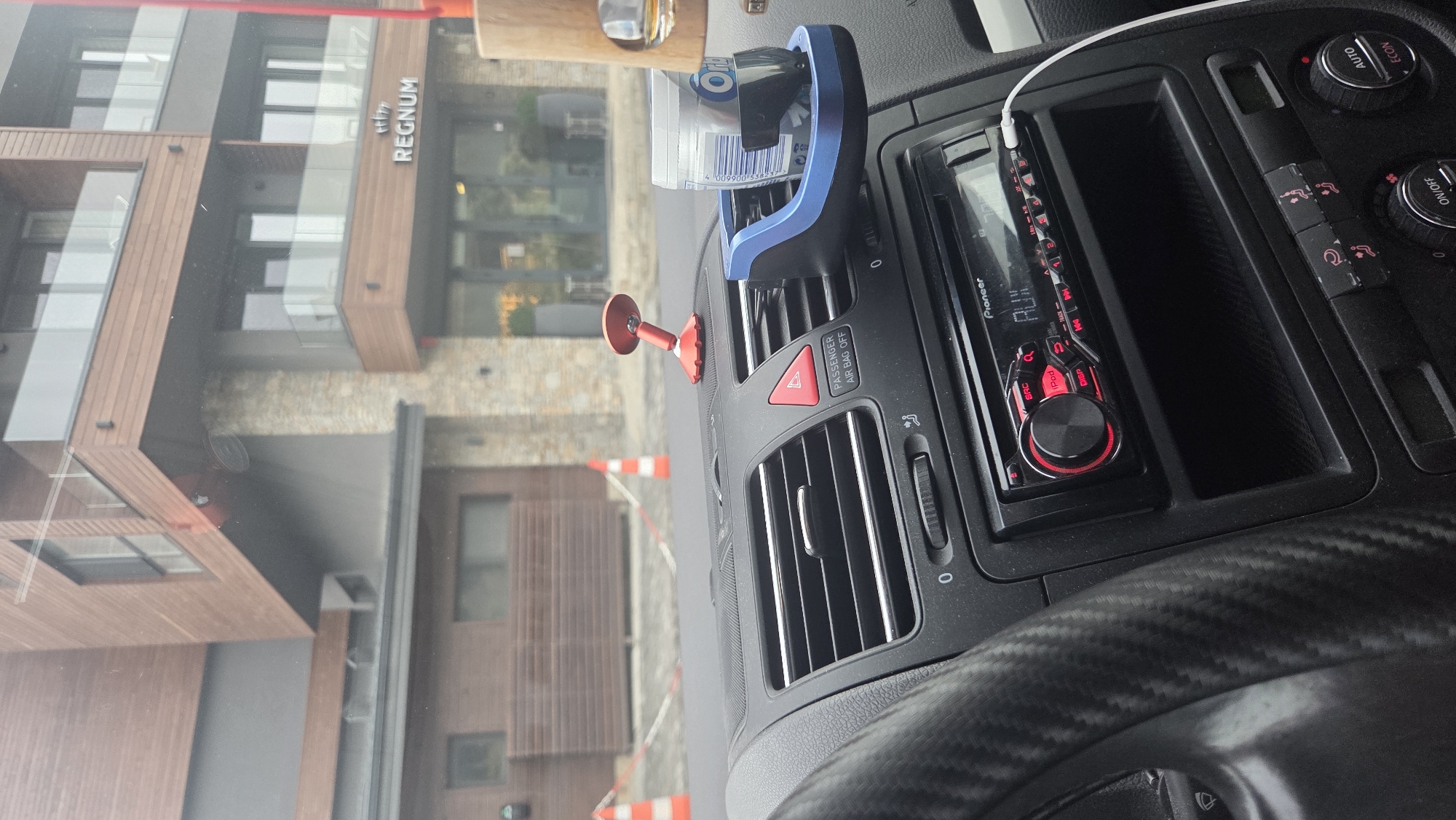 Car interior details and a worn concrete corridor