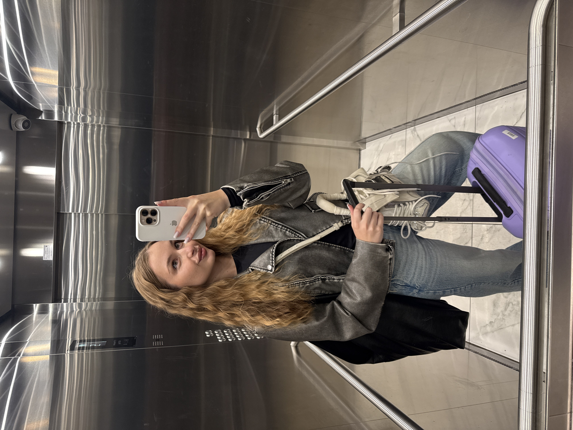 Woman takes early morning selfies in Belgrade elevator, bathroom