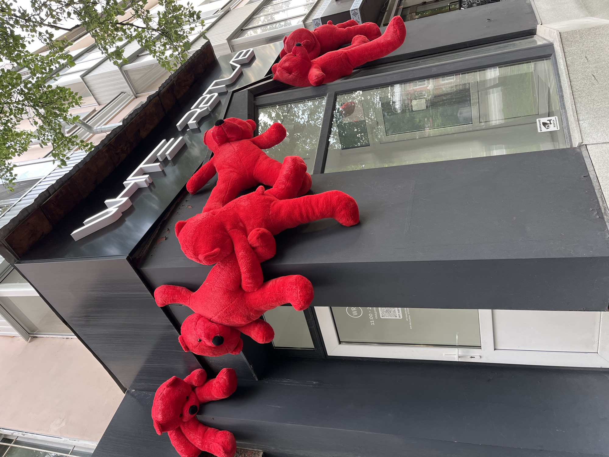 Red teddy bear art installation spotted on Yekaterinburg building