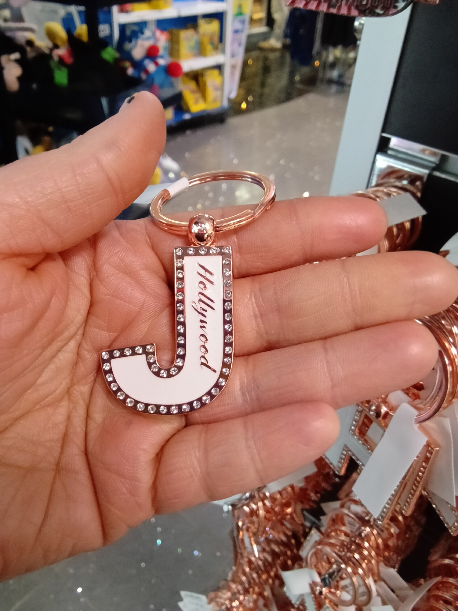 Traveler photographs personalized keychains at LAX United Polaris lounge
