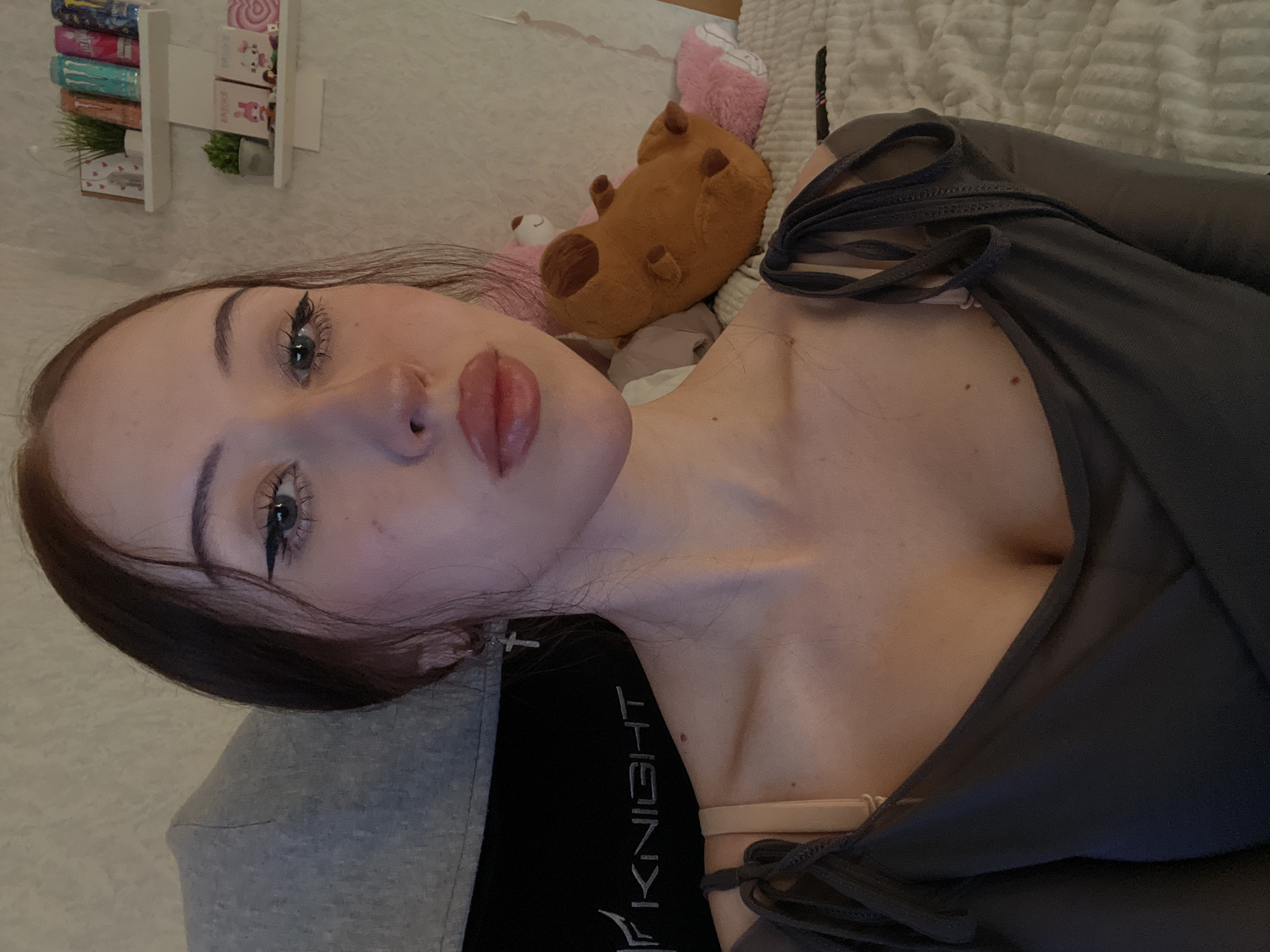 Young woman photographs herself indoors in Votkinsk, Russia