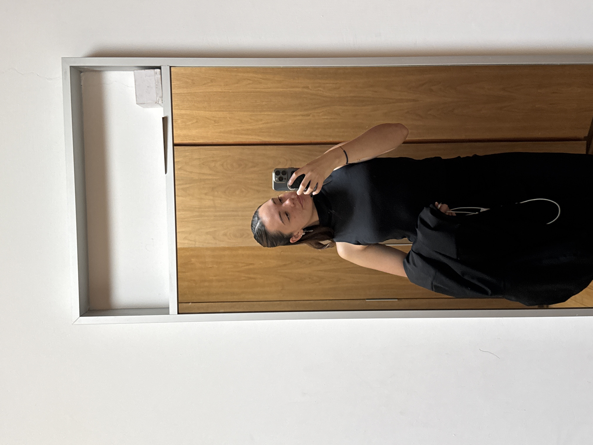 Woman takes mirror selfie in San Bernardino Tlaxcalancingo, Mexico