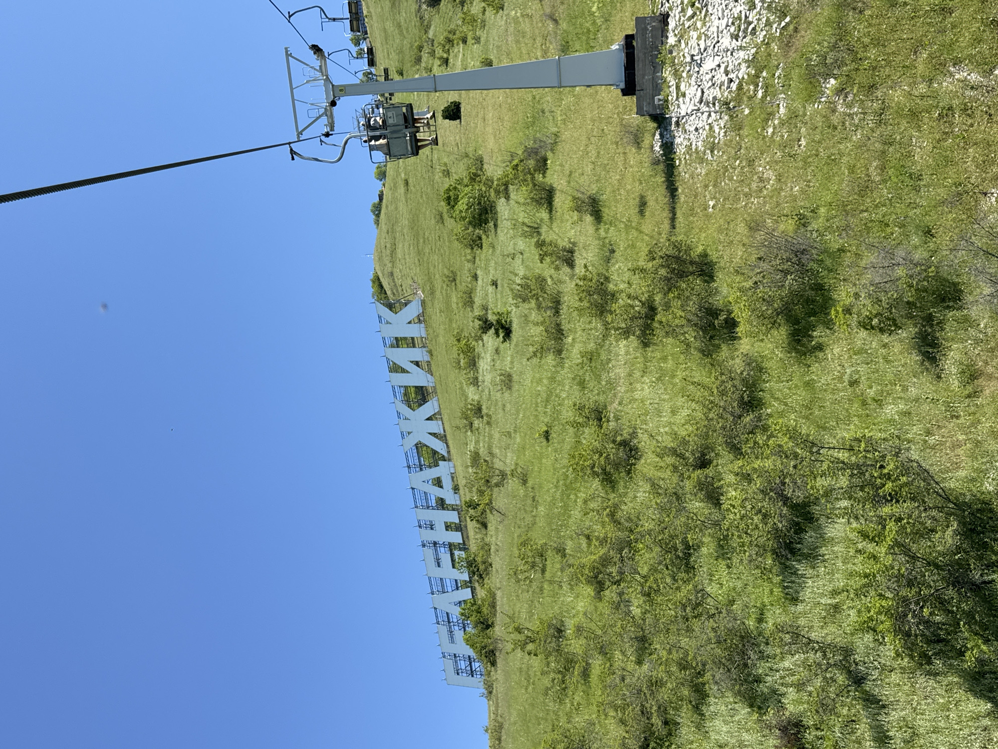 Chairlift ride documented across green hillsides in Gelendzhik, Russia