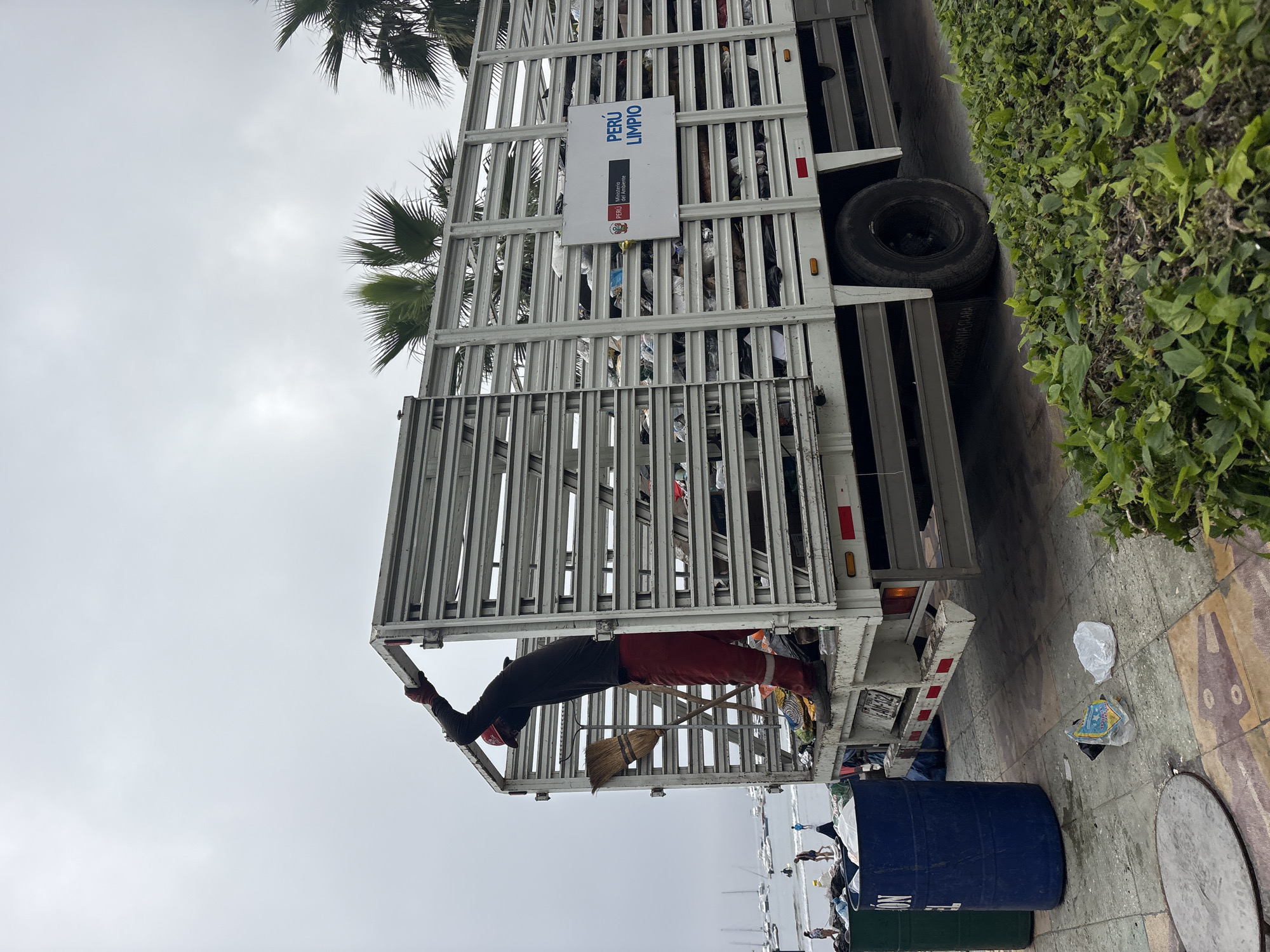 Waste truck conducts collection operations in Ancón, Peru