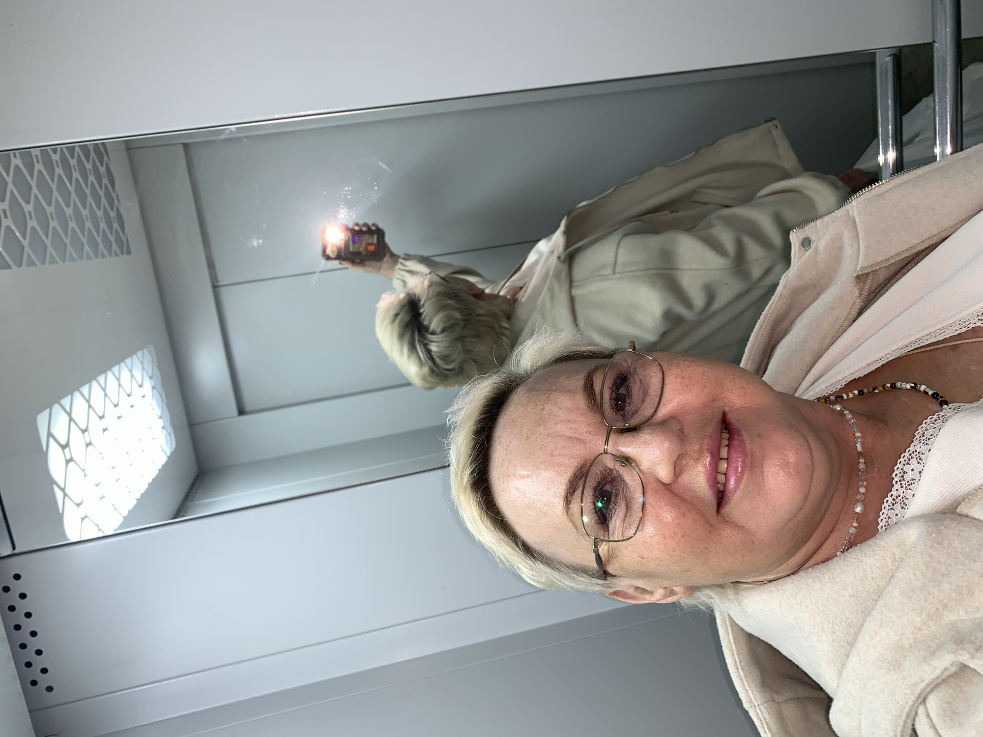 Woman takes indoor and outdoor selfies in Chaikovsky