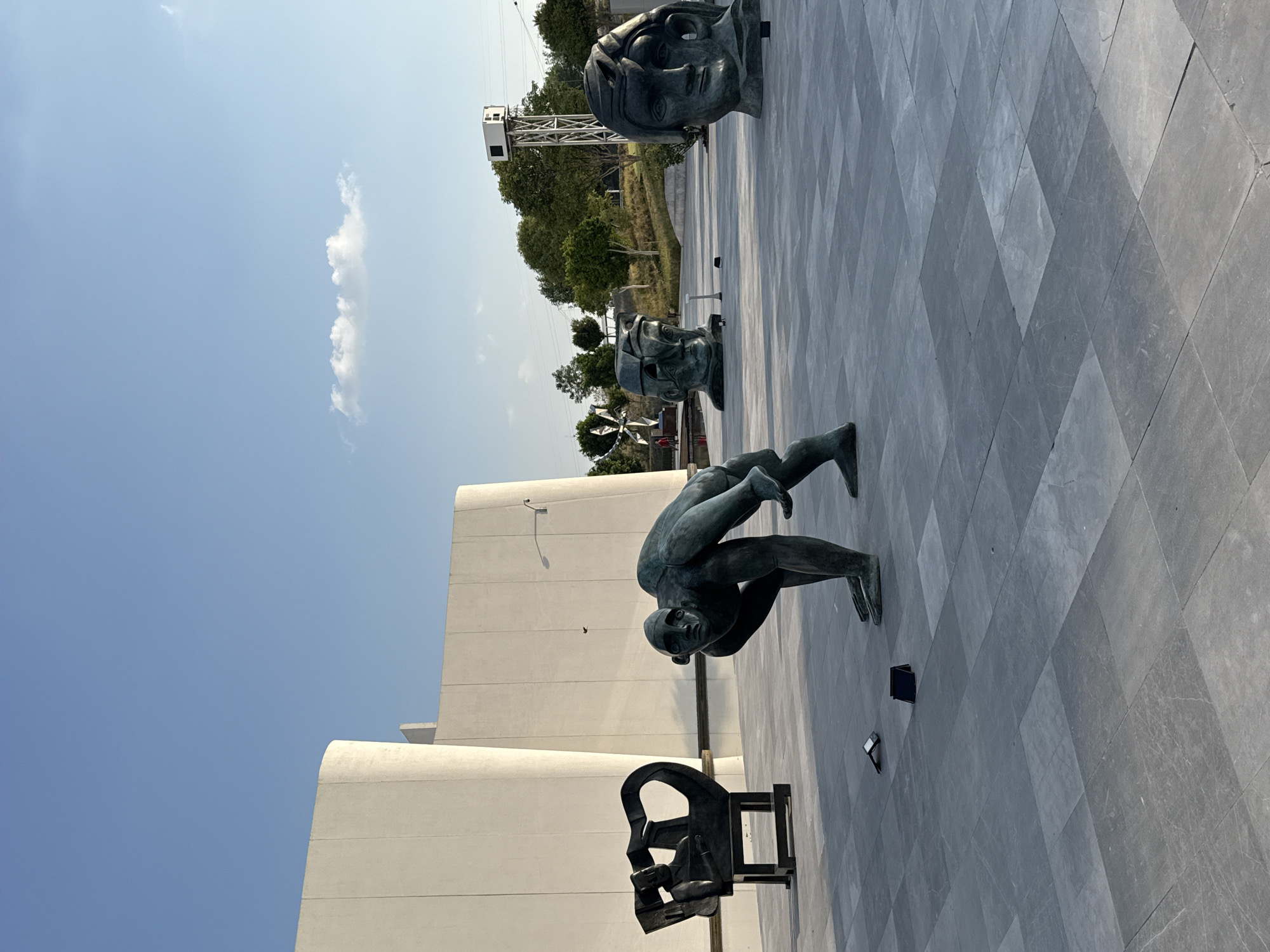 Visitor documents bronze sculptures at International Baroque Museum