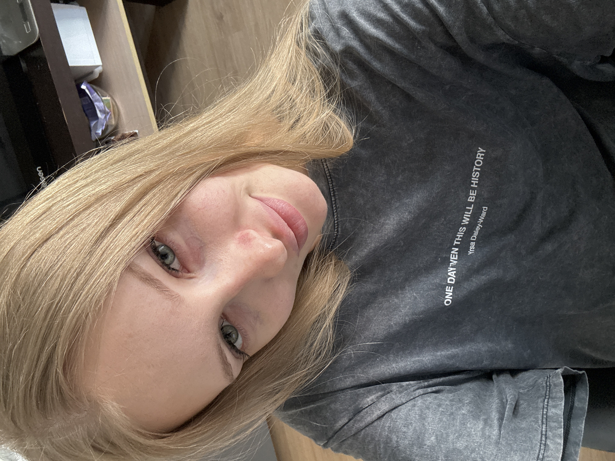 Woman takes selfies in Perm wearing literary t-shirt