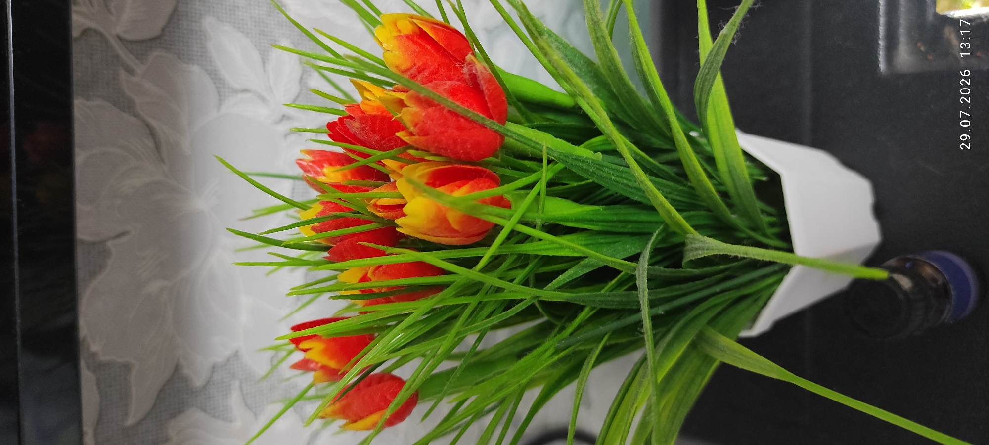 Flowers, fish tanks, and friendship decor in a cozy indoor setting