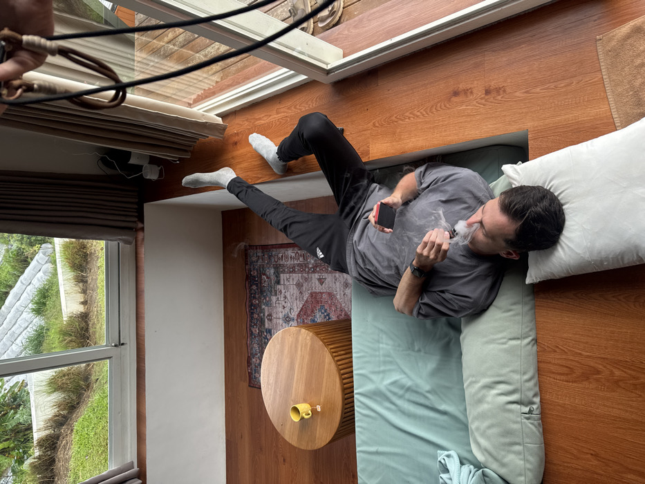 Tourists document highland Bali eco-lodge stay amid misty mountain scenery