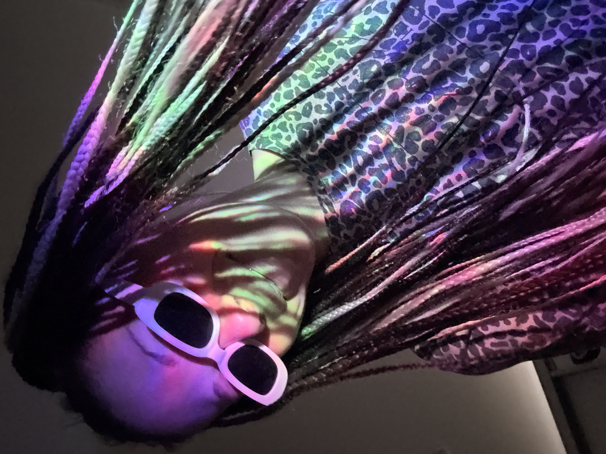 Person photographed under colorful lights in Rusanovo, Russia
