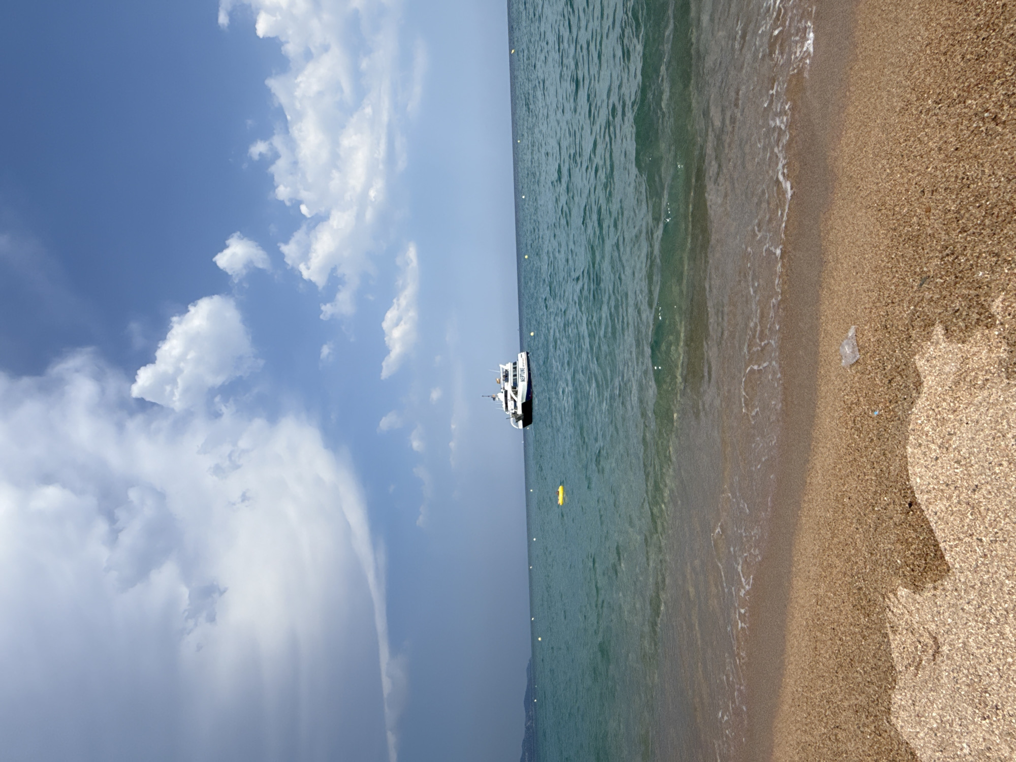 Sun, boats, and beach chaos on a summer afternoon in Blanes